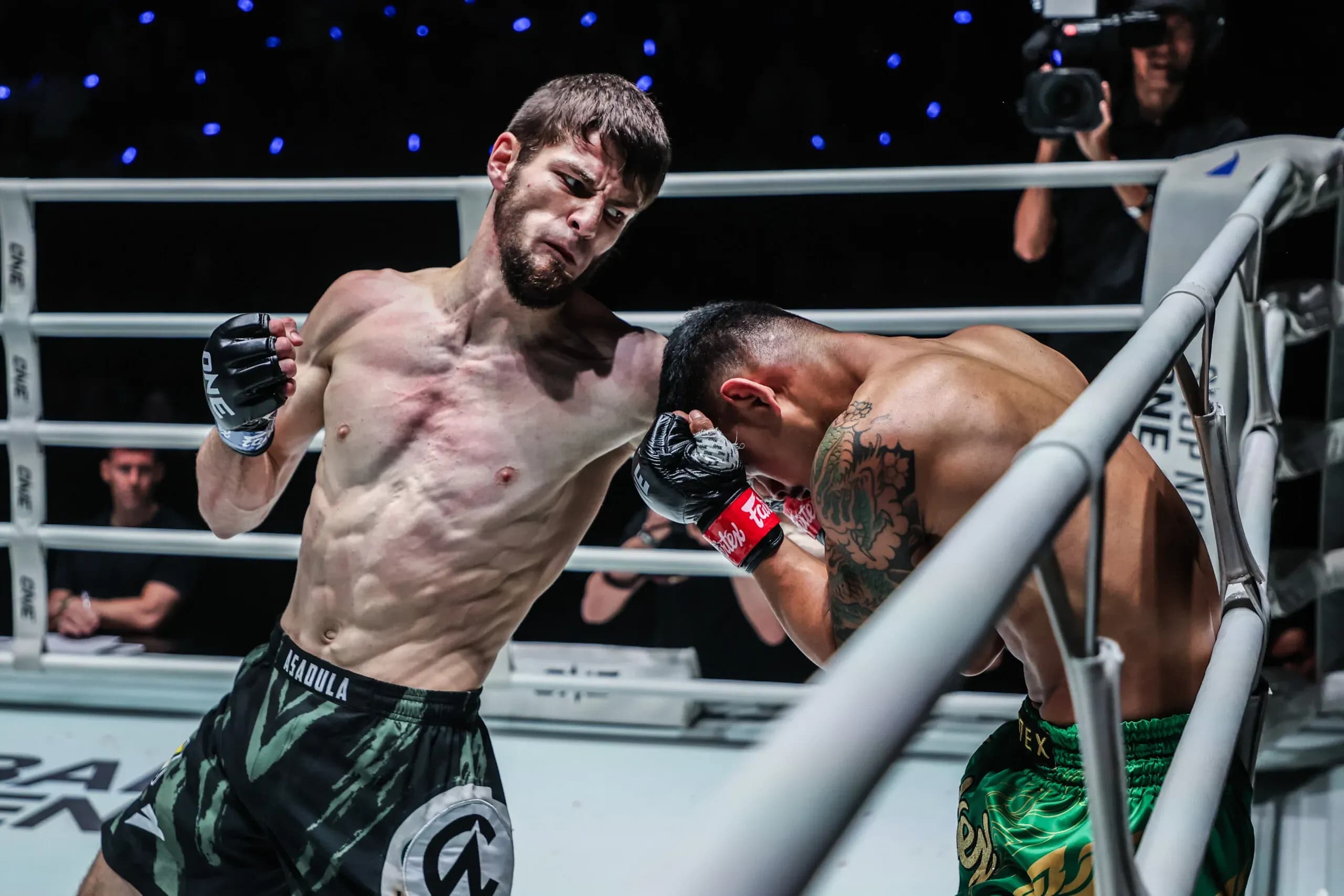 Russian Muay Thai fighter Asadula Imangazaliev punches Nong-O