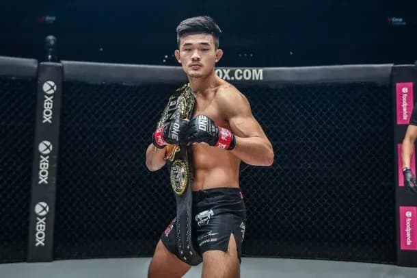 Christian Lee poses with the ONE Championship belt in the Circle