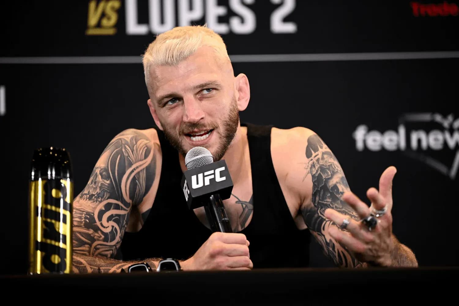 Dan Hooker speaking to reporters at a press conference 