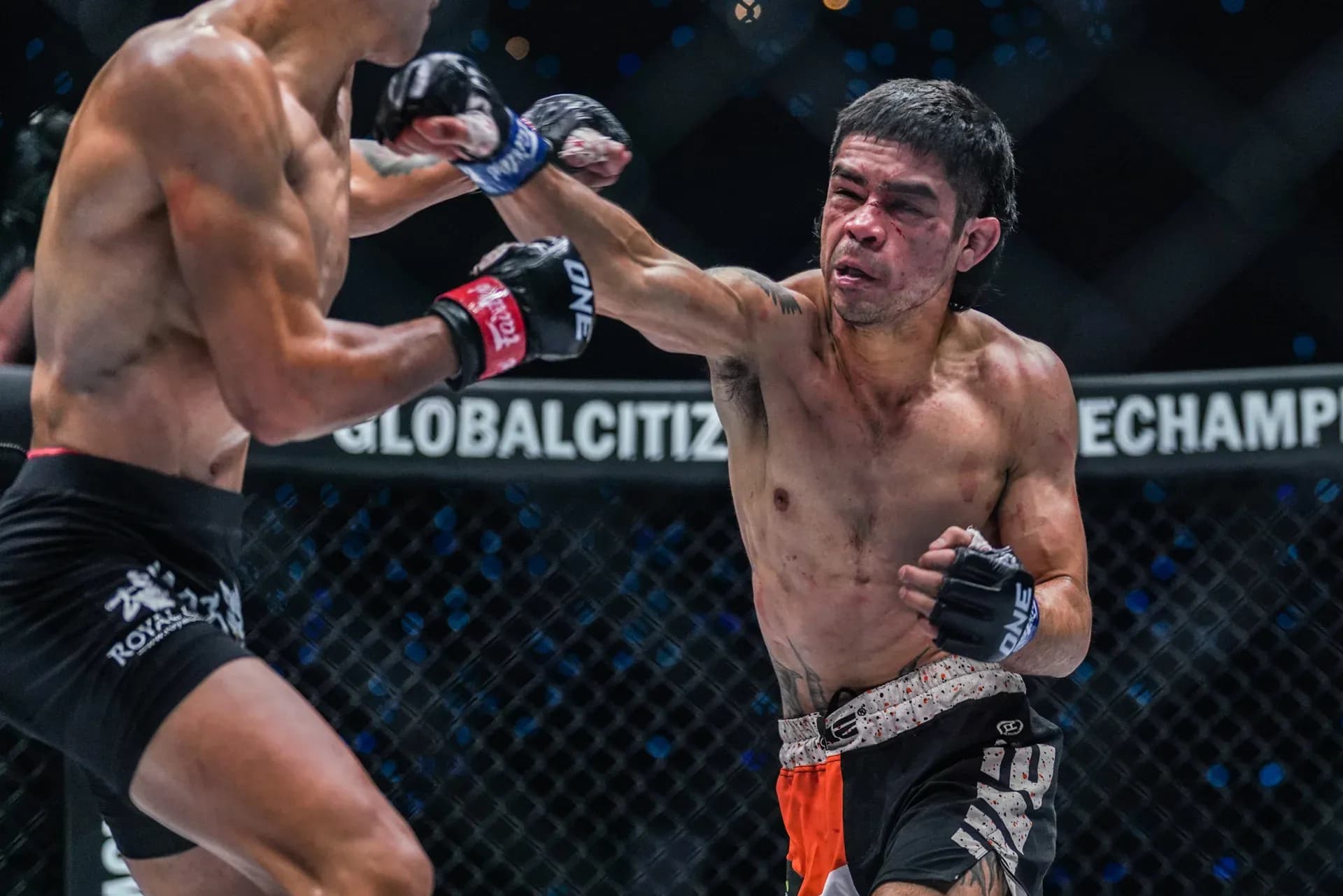 Danial Williams throws a punch inside the ONE cage.