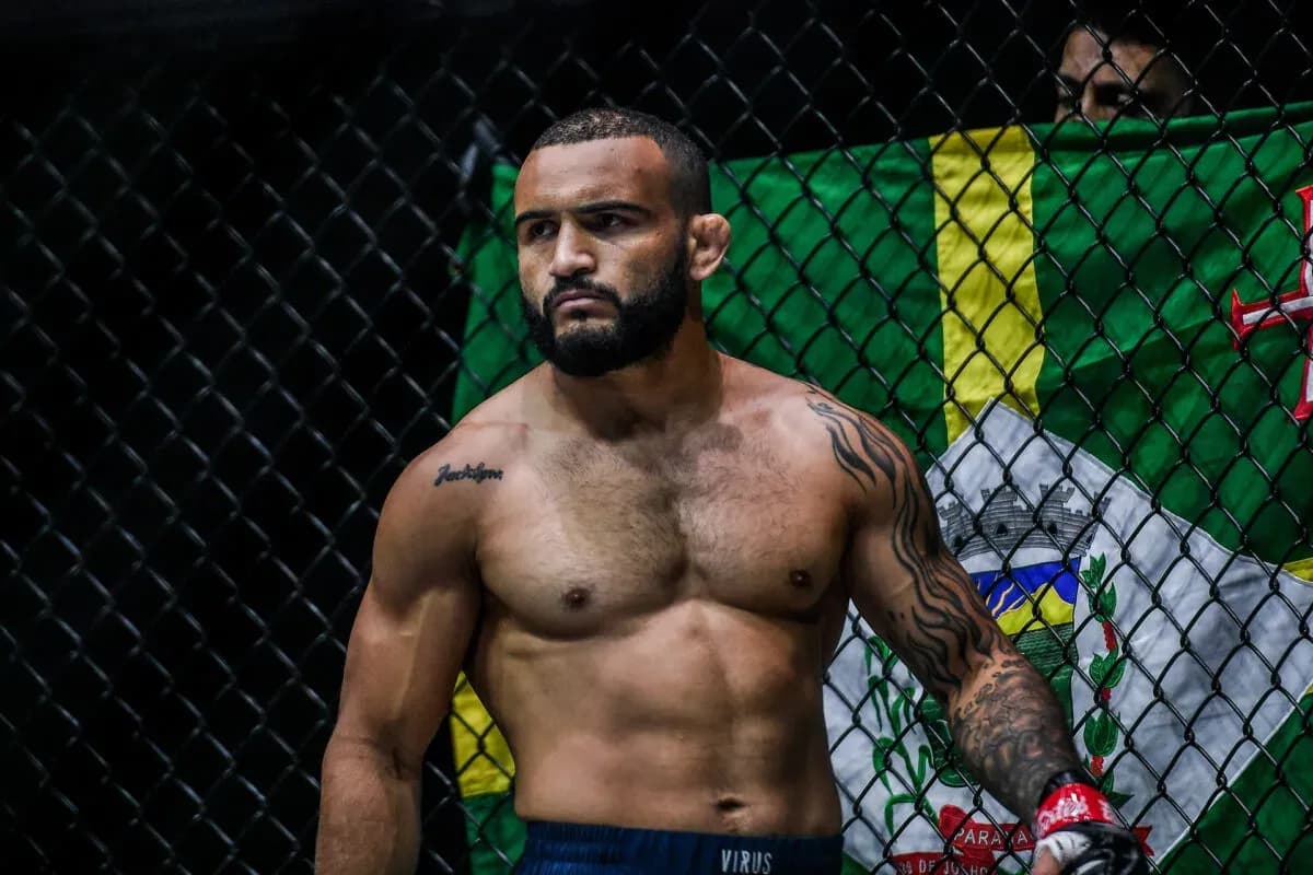 MMA fighter John Lineker stands in the cage
