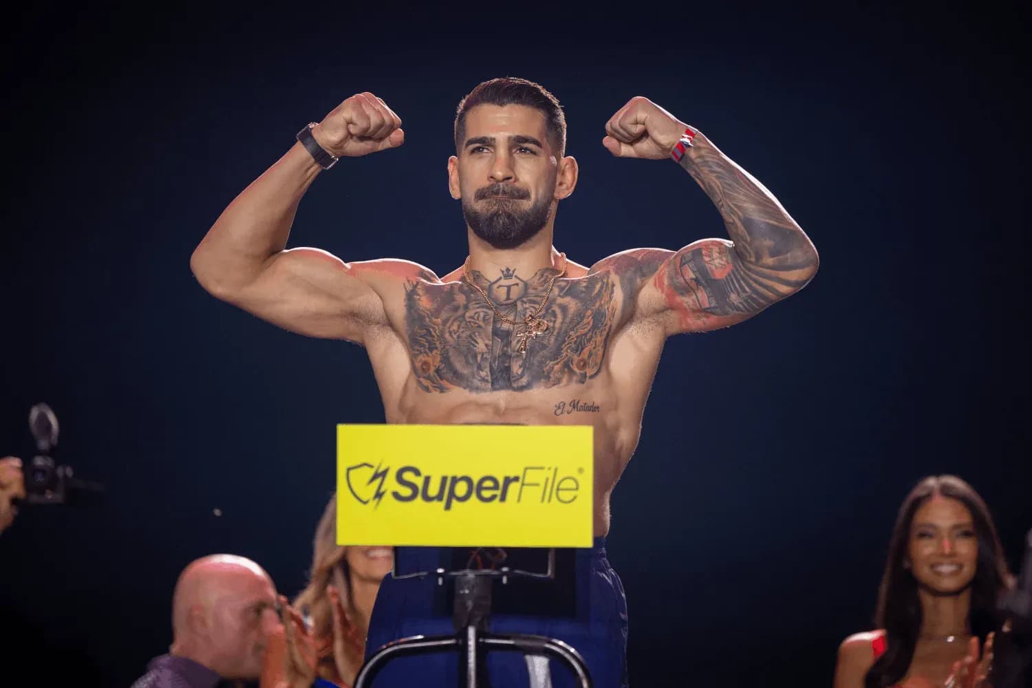 Ilia Topuria poses after making weight at the UFC ceremonial weigh-ins