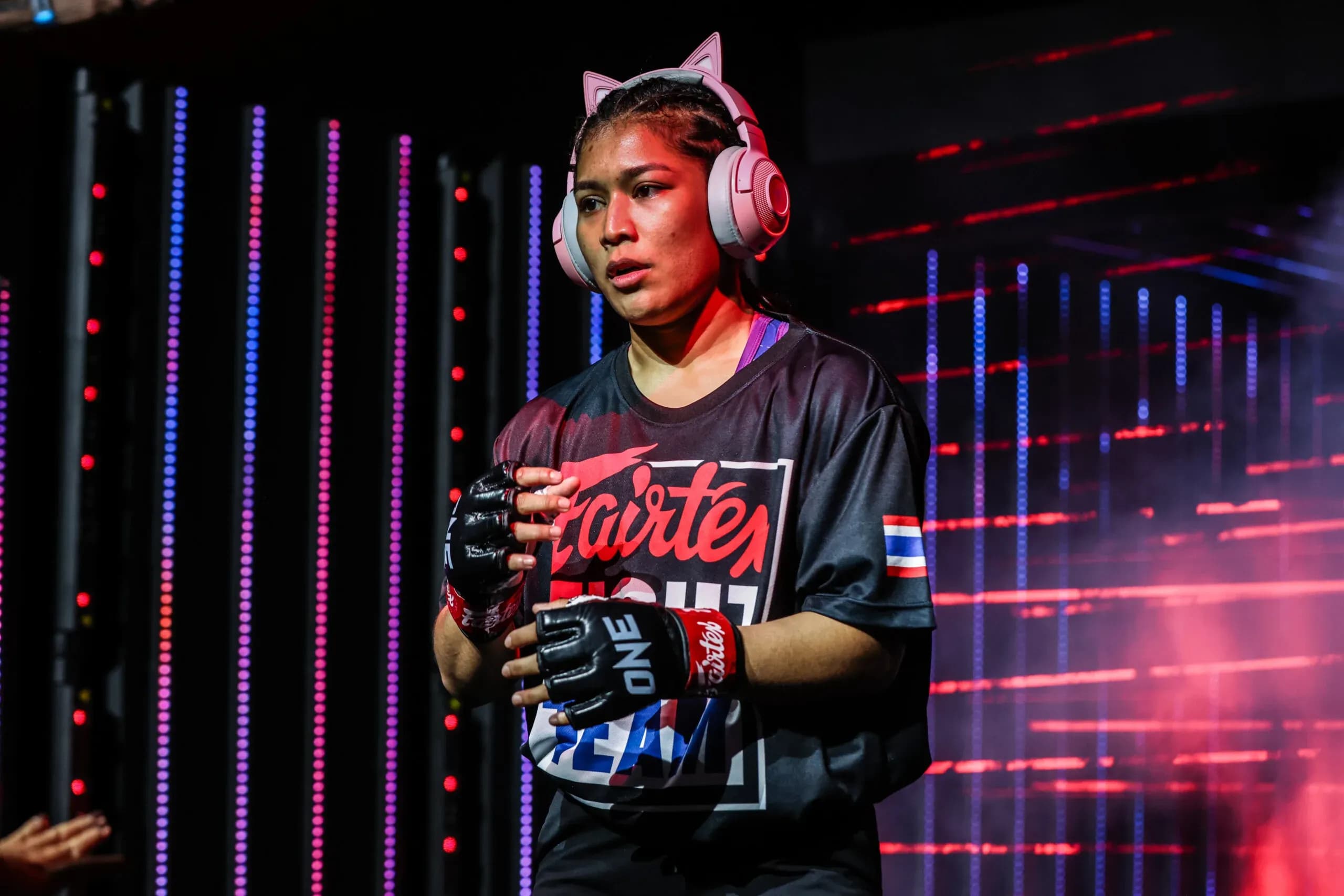 MMA fighter Jihin Radzuan makes her entrance with cat-ear headphones