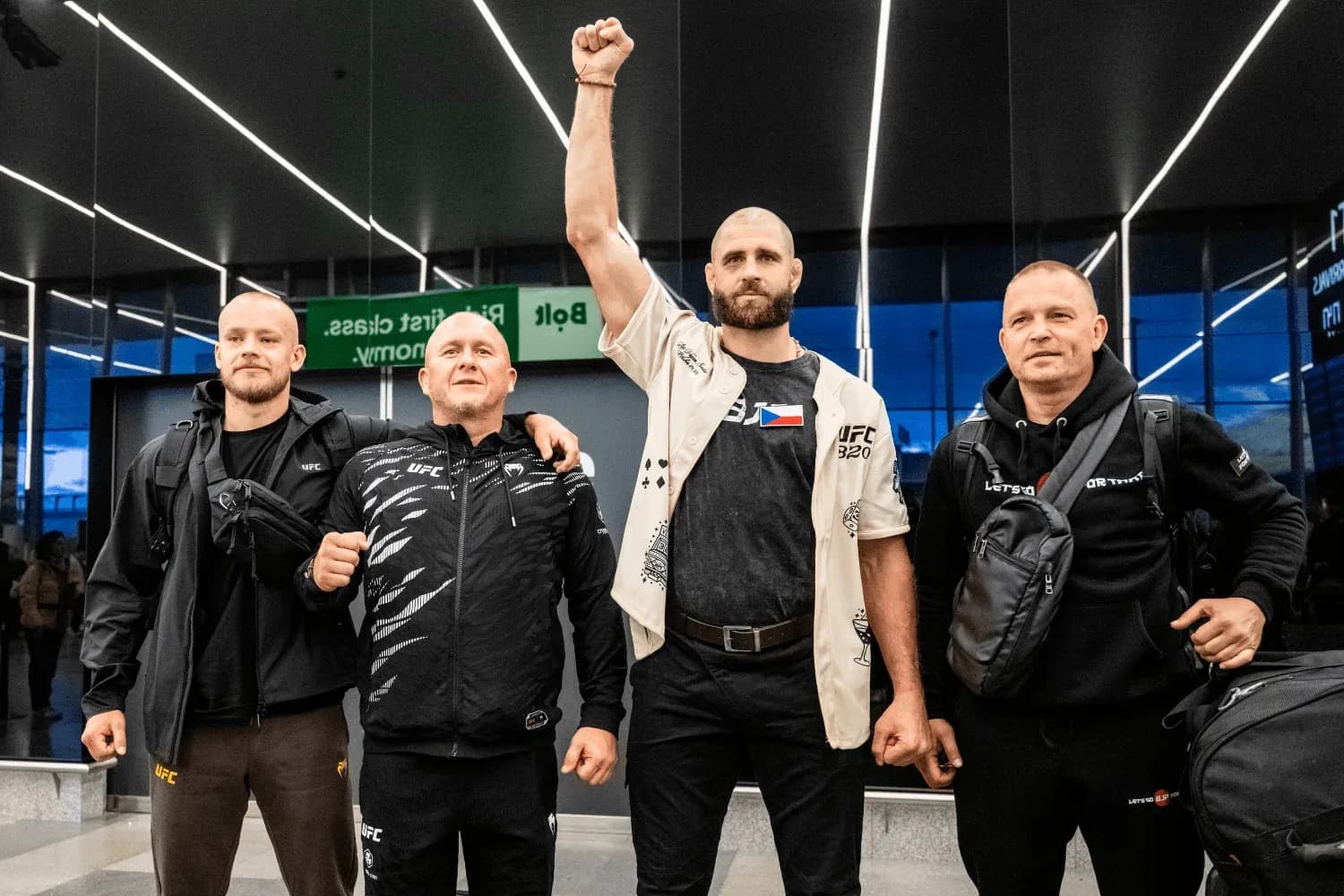 Jiri Prochazka stands alongside his team