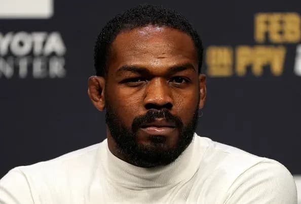 Jon Jones with a shotgun