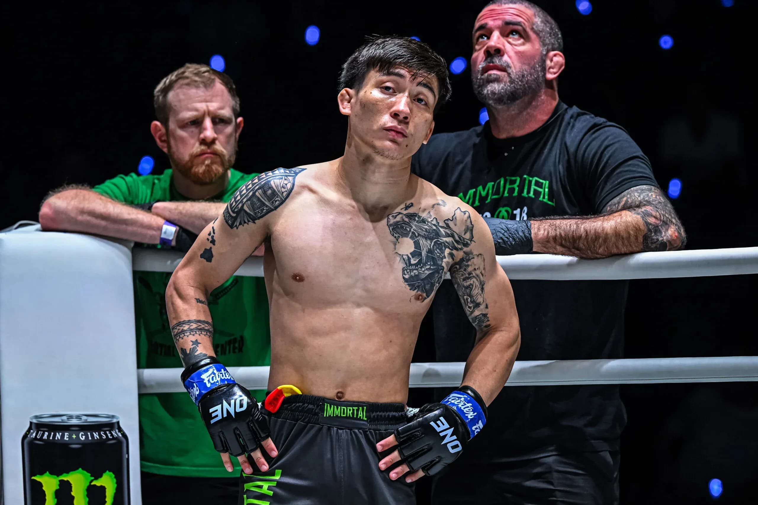 MMA fighter Joshua Perreira stands in the corner with his coach Matt Brown