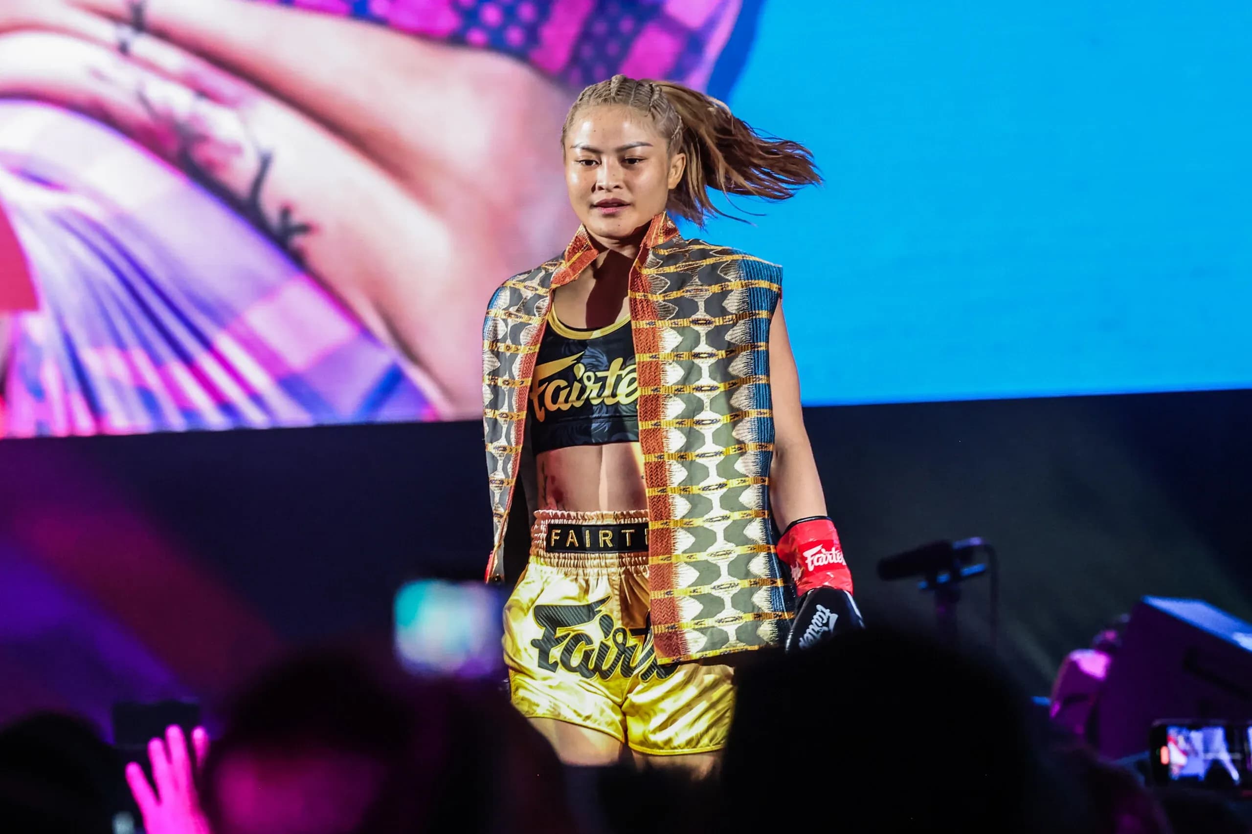 Stamp Fairtex makes her entrance with blond hair