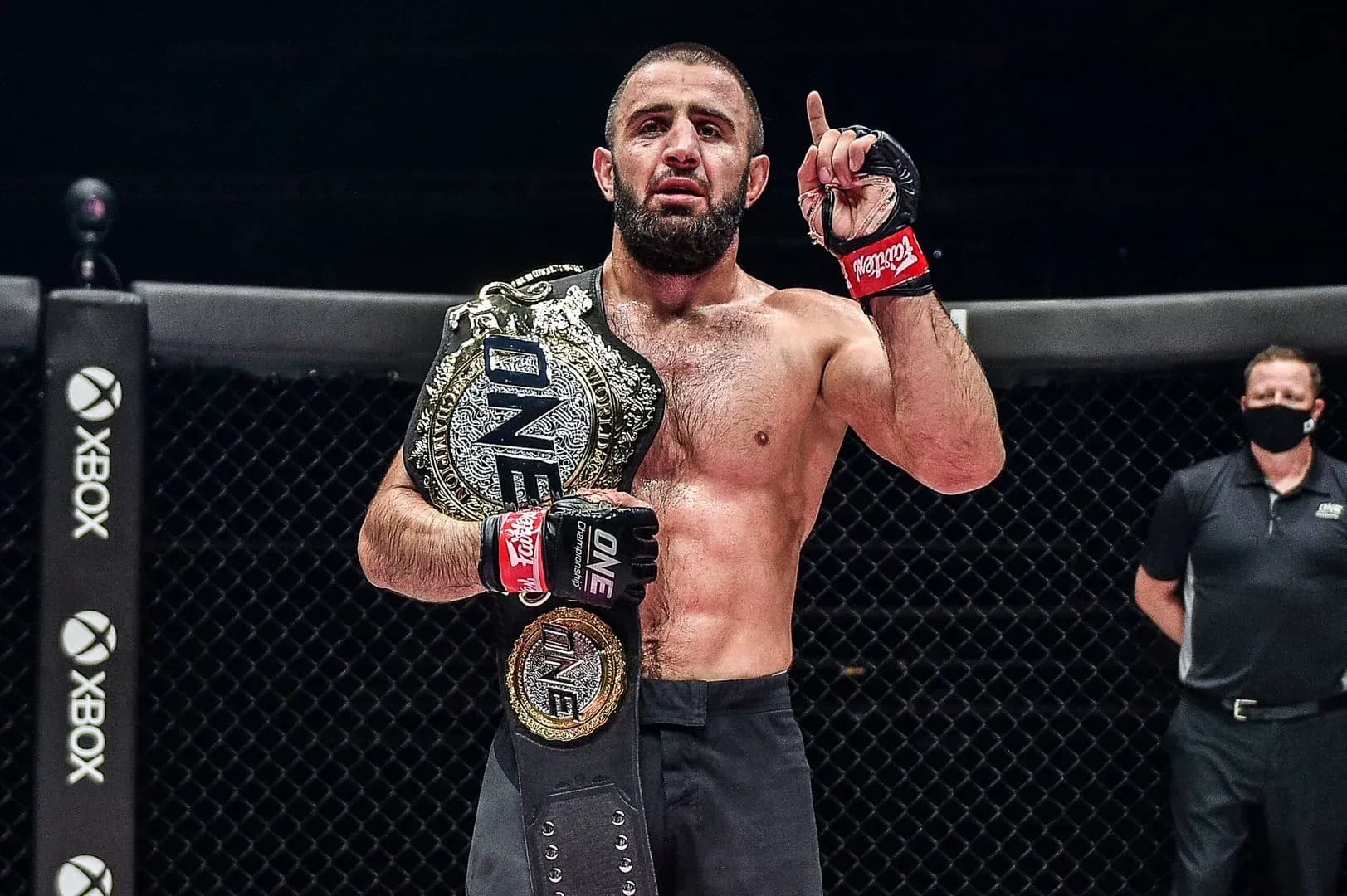 Kiamrian Abbasov stands victorious with ONE welterweight championship.