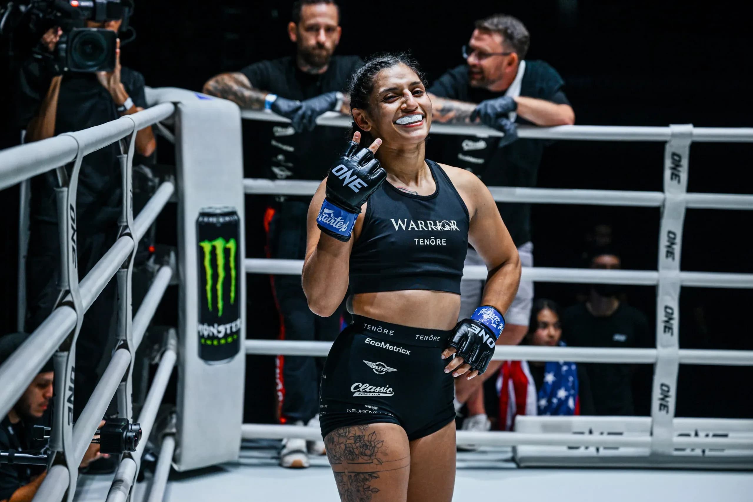 Atomweight MMA fighter Natalie Salcedo poses after her win in the ring