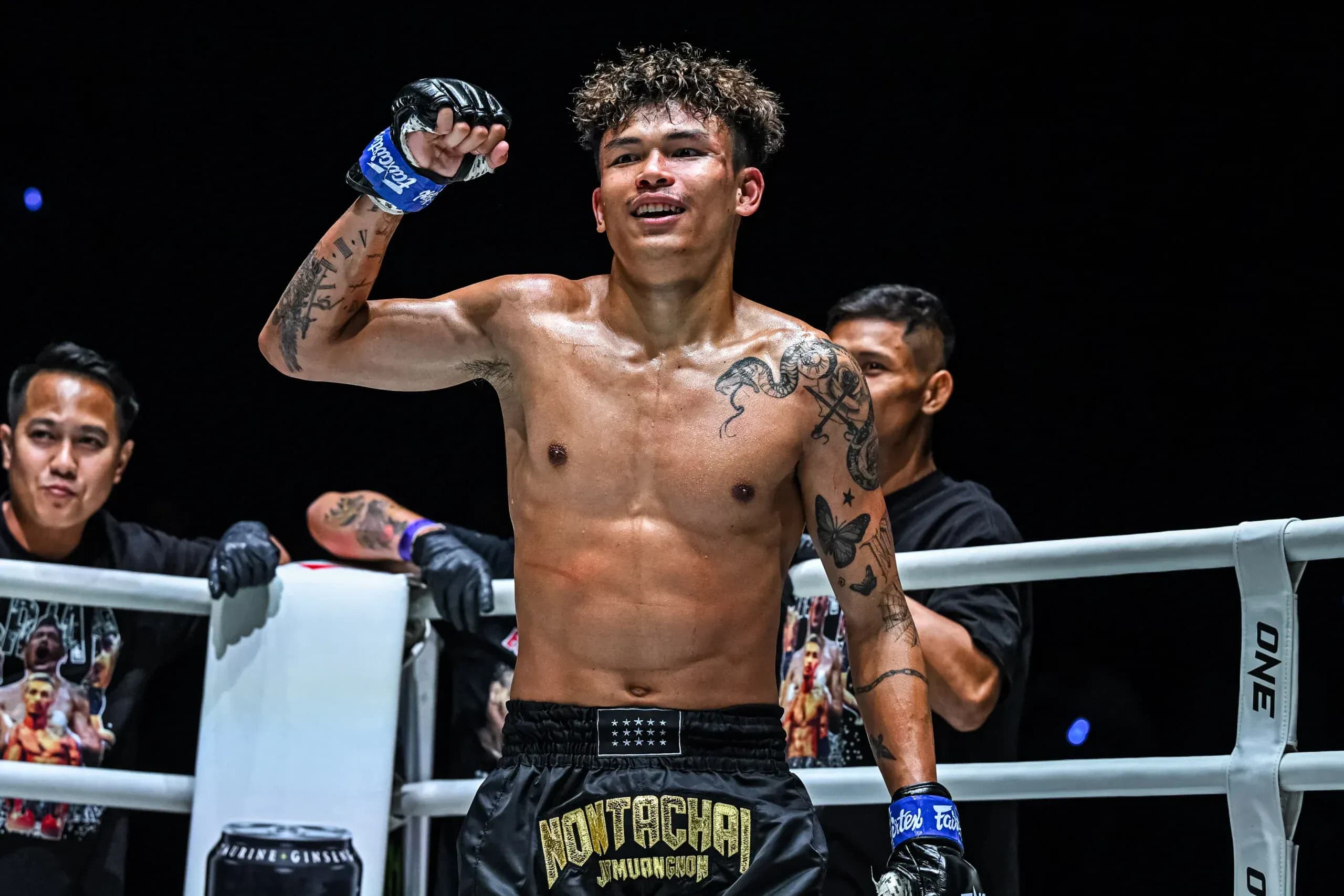 Muay Thai fighter Nontachai Jitmuangnon raises his fist