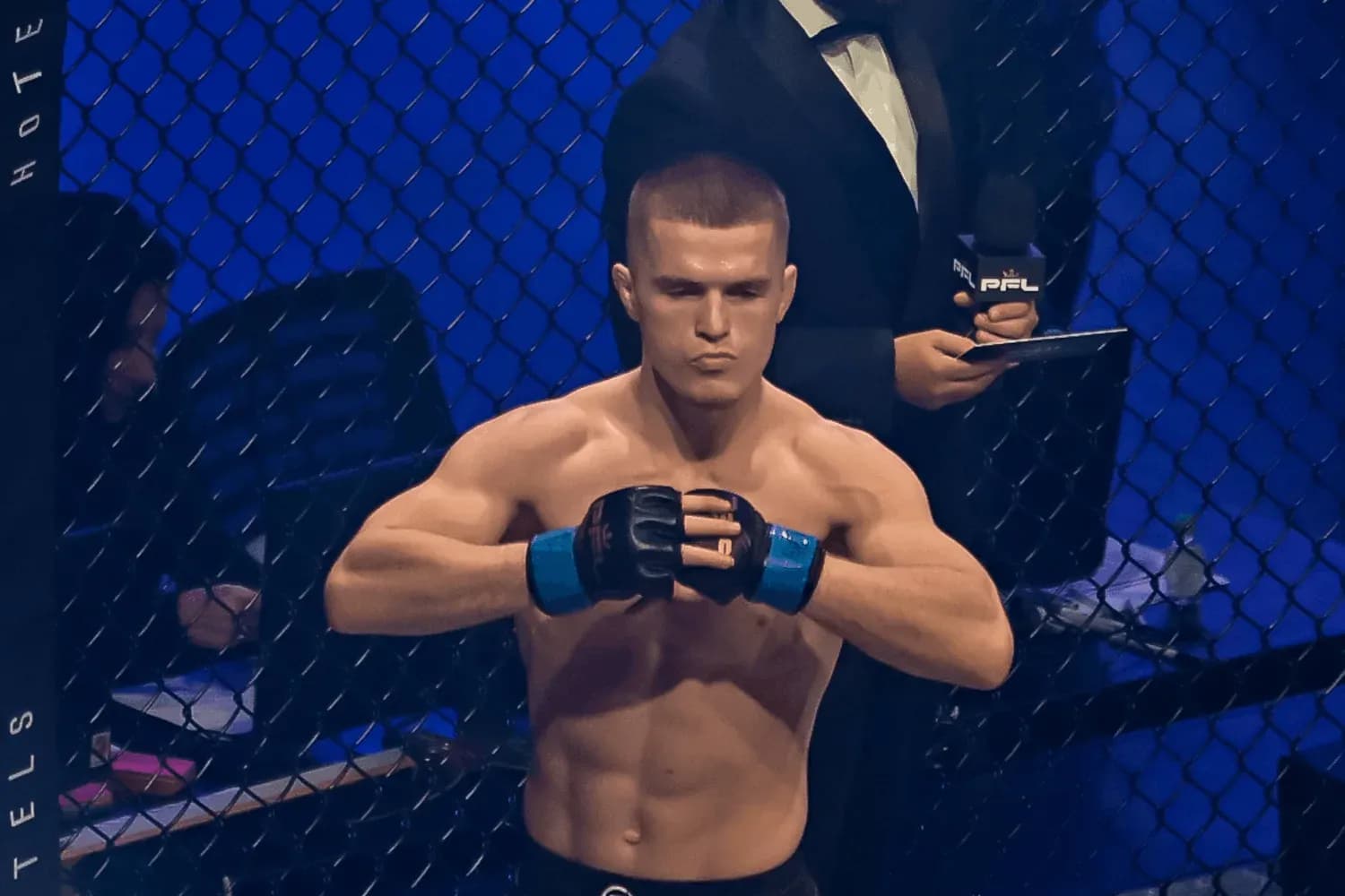 Paul Hughes inside the cage before a fight