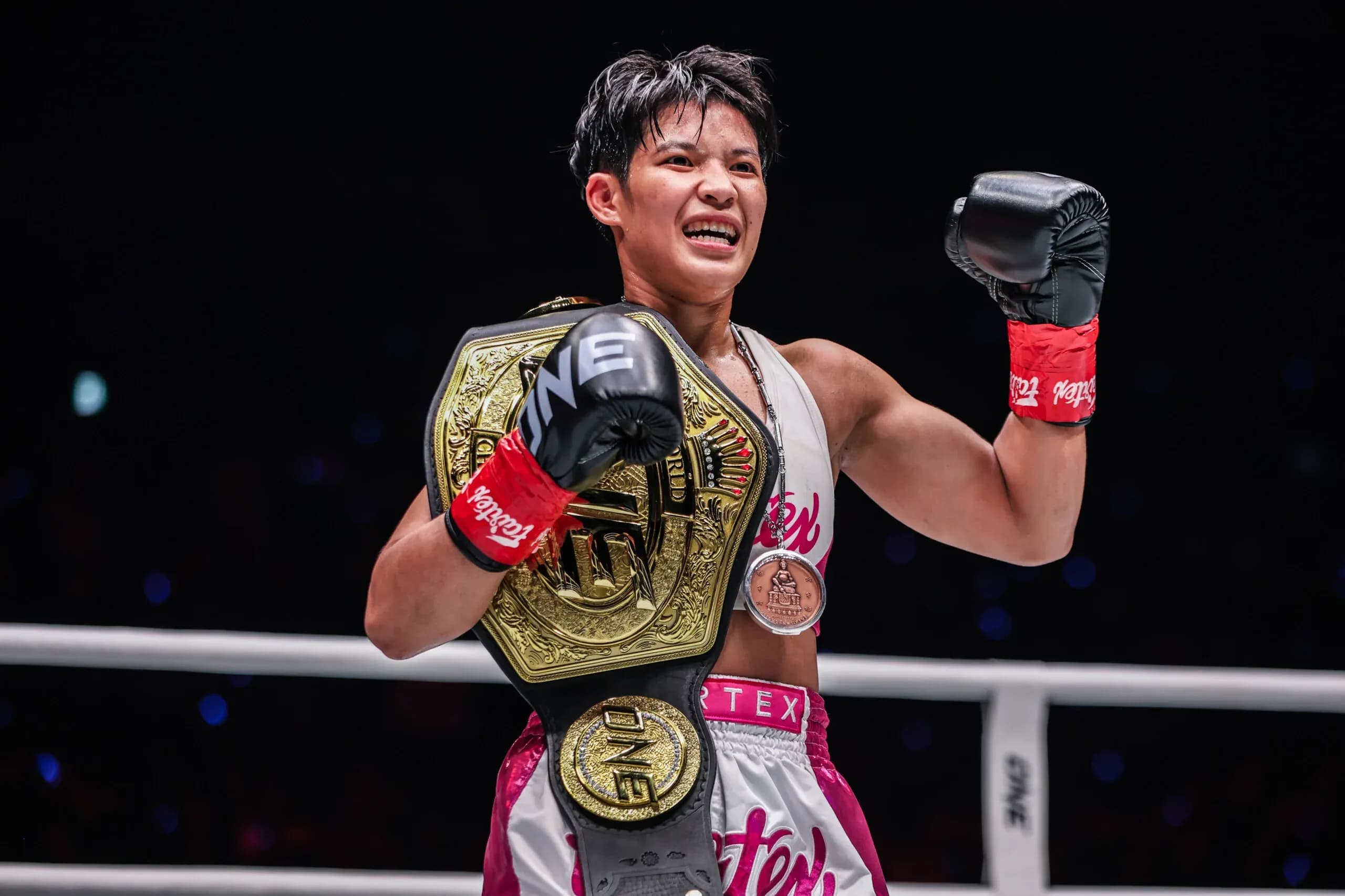 Phetjeeja Lukjaoporongtom celebrates with the ONE Championship belt