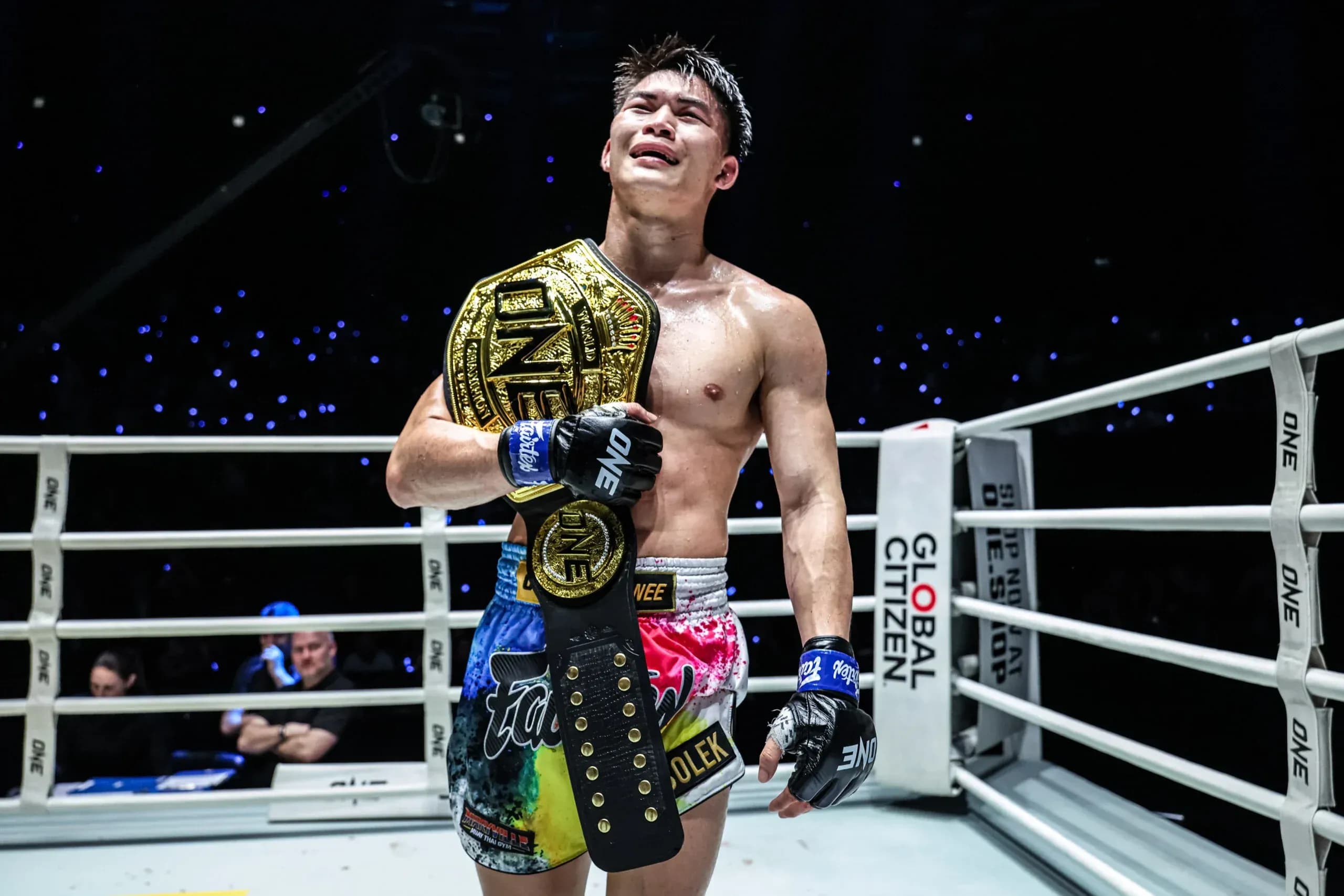 ONE Bantamweight Muay Thai World Champion Rambolek Chor Ajalaboon stands in the ring with the belt