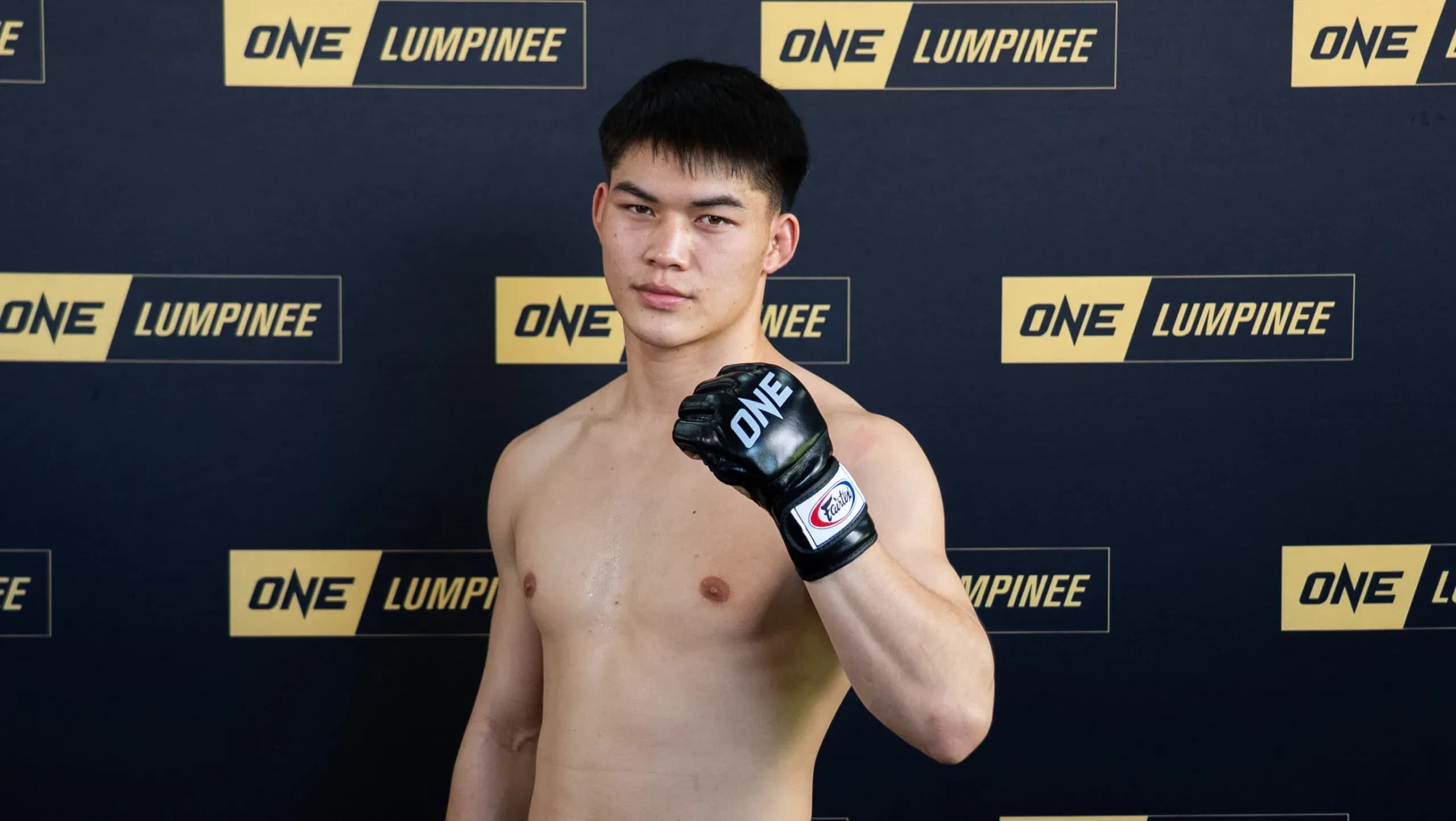 Muay Thai fighter Rambolek Chor Ajalaboon pumps his fist at the ONE Friday Fights 147 Open Workout