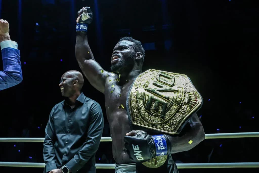 "Reug Reug" Oumar Kane poses with the ONE Championship belt in the ring