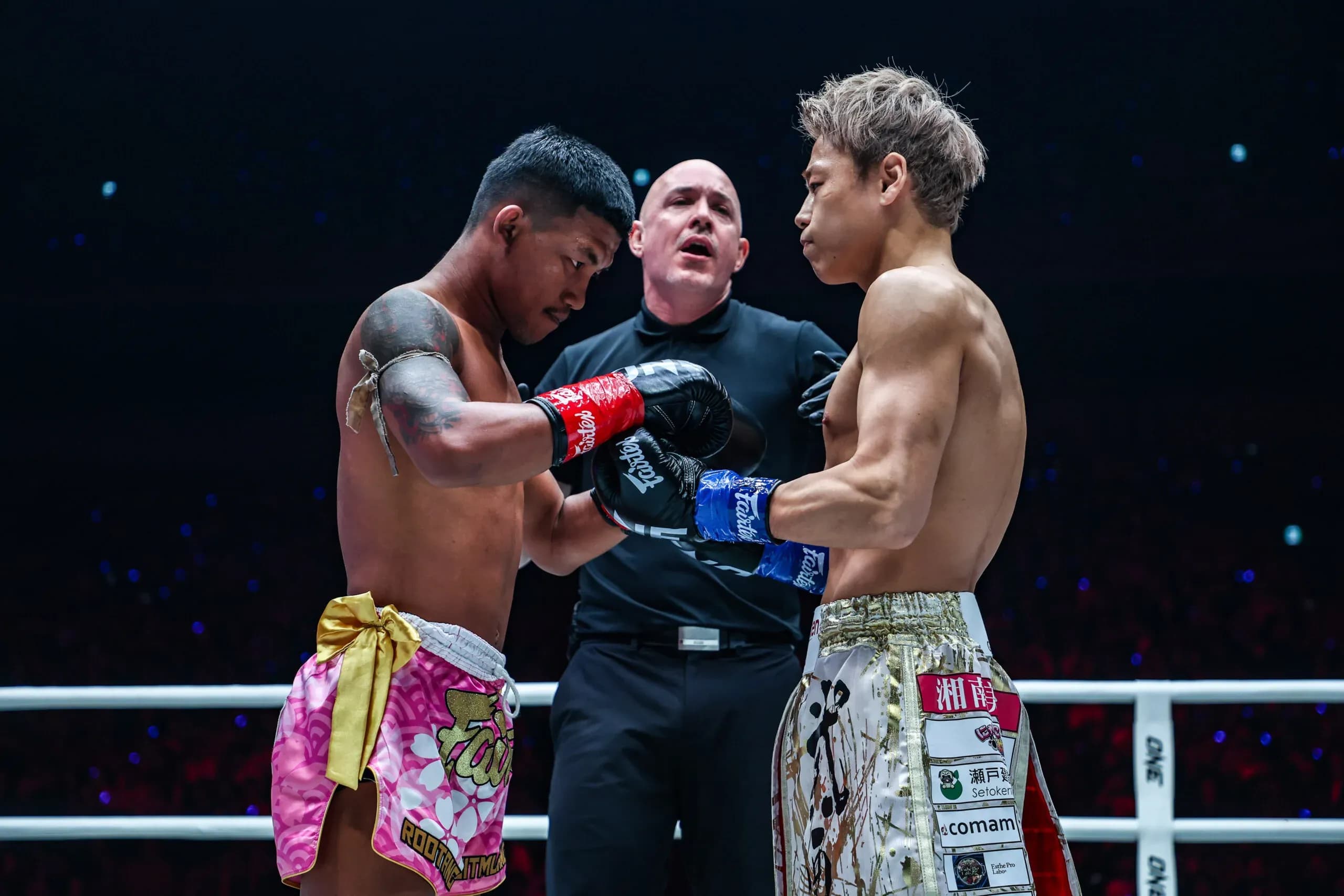 Rodtang and Takeru touch gloves