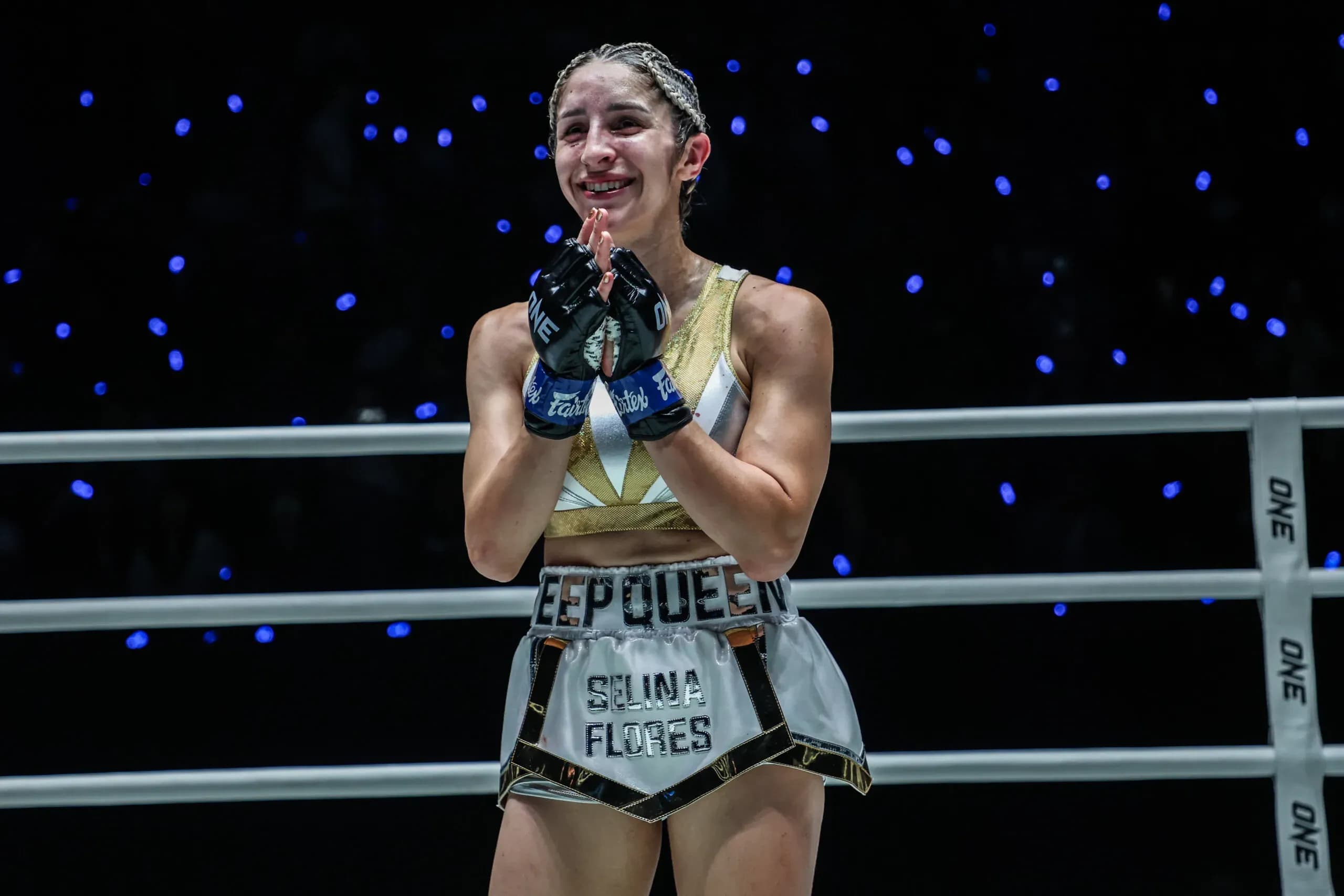 Muay Thai fighter Selina Flores celebrates following her win
