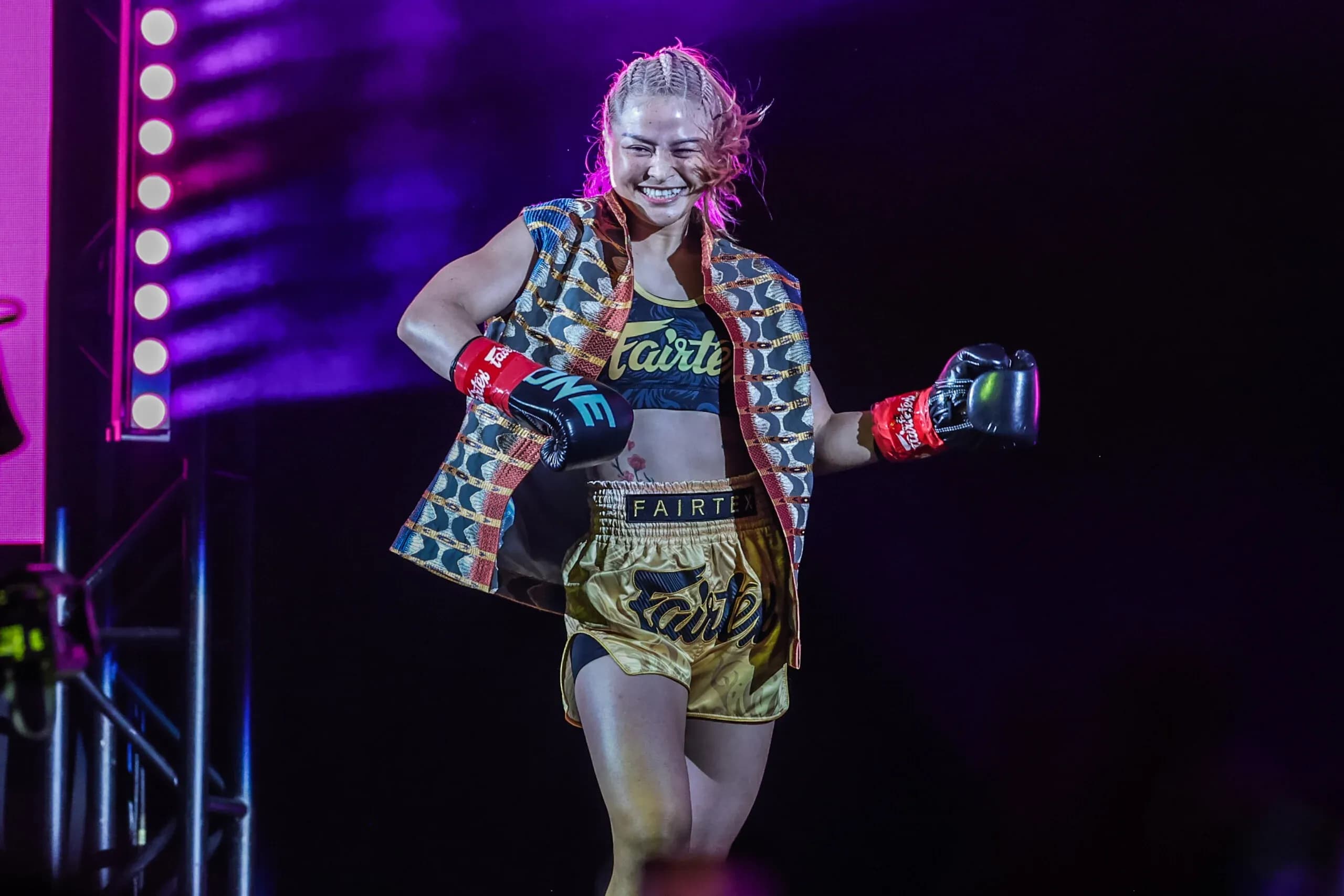 Stamp Fairtex makes her entrance