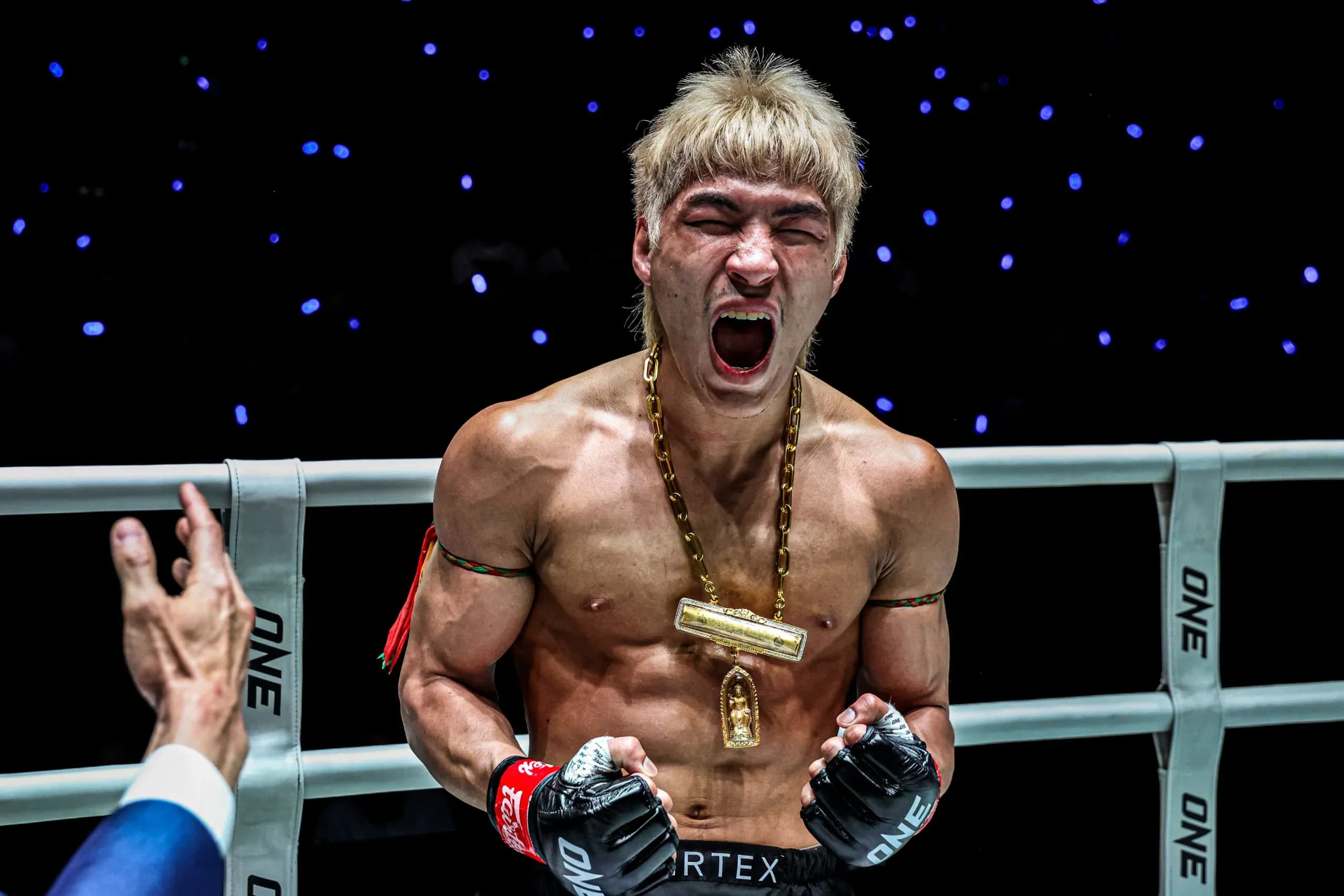 Muay Thai fighter Yod-IQ celebrates after his win