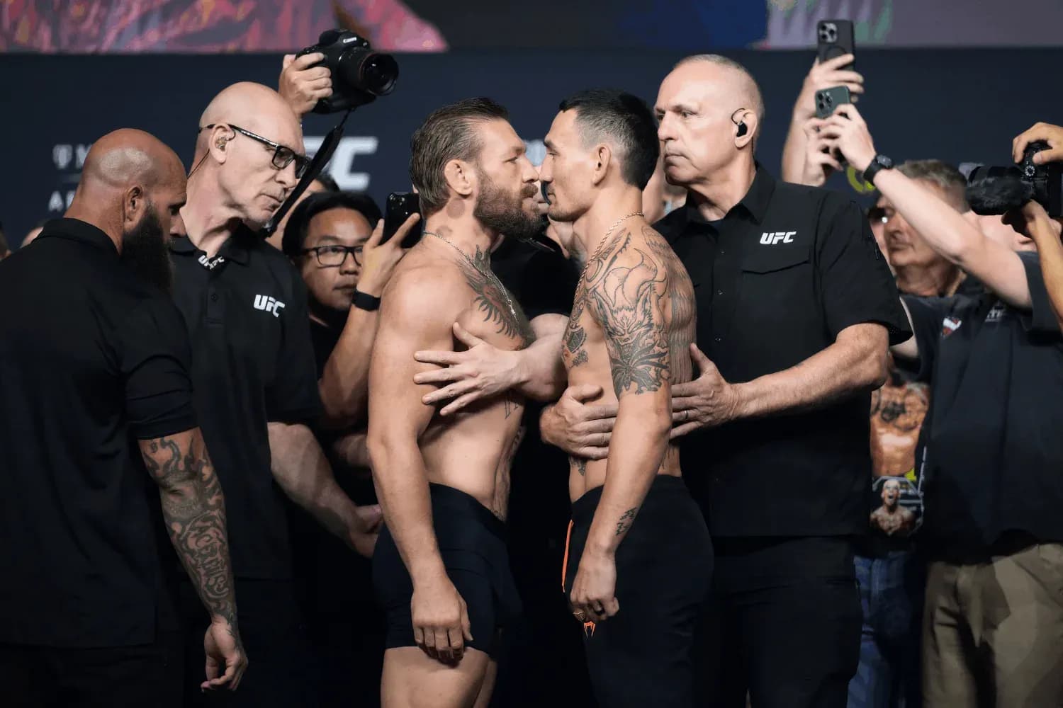 Conor McGregor (left) faces off against Max Holloway (right) before their clash at UFC 329