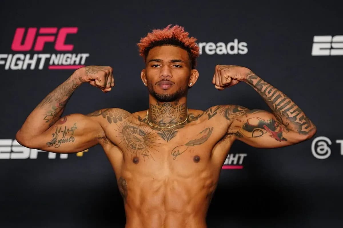 Michael Morales steps on the scale ahead of his fight with Gilbert Burns