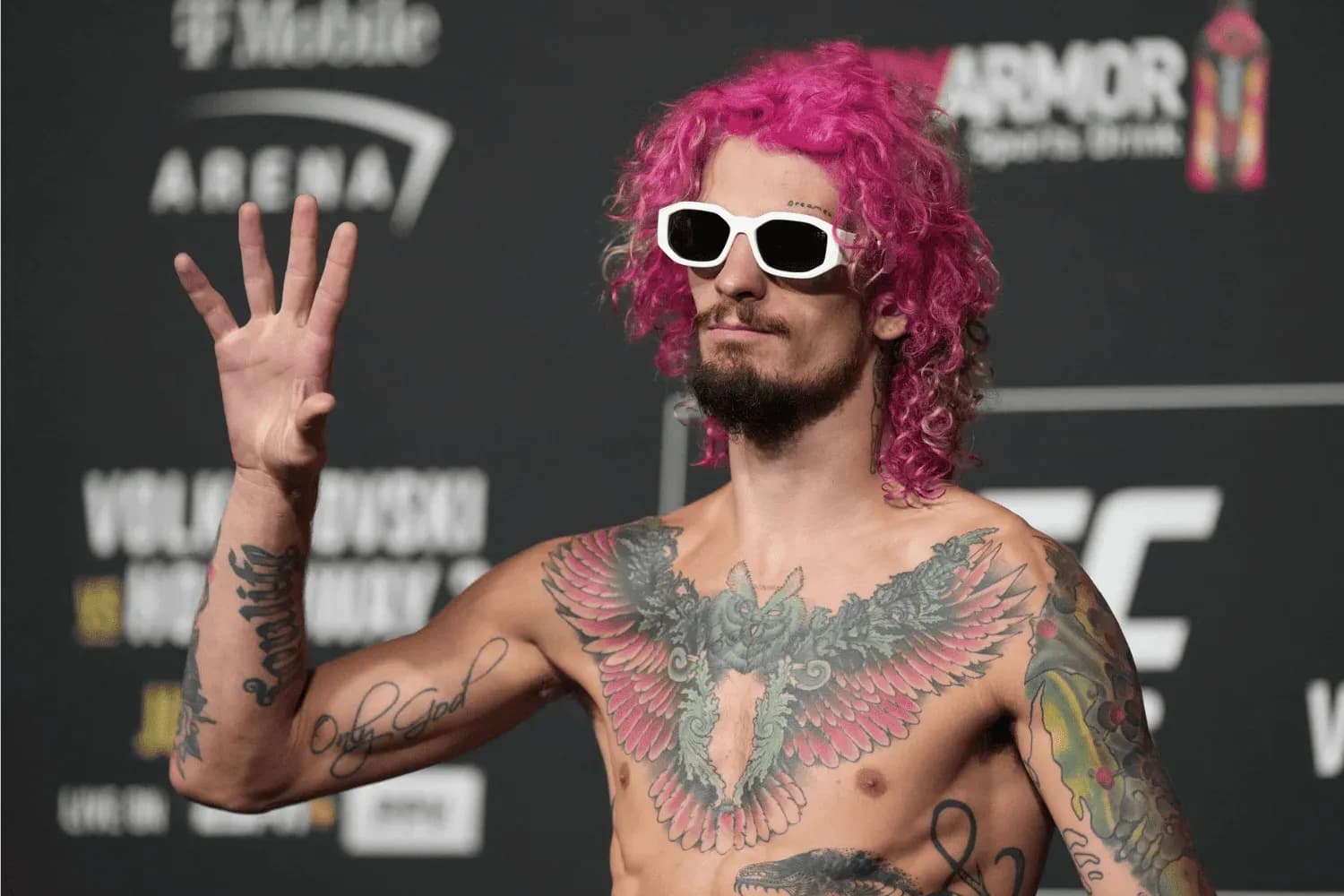Sean O'Malley steps on the scale for the official weigh-ins at T-Mobile Arena for UFC 276
