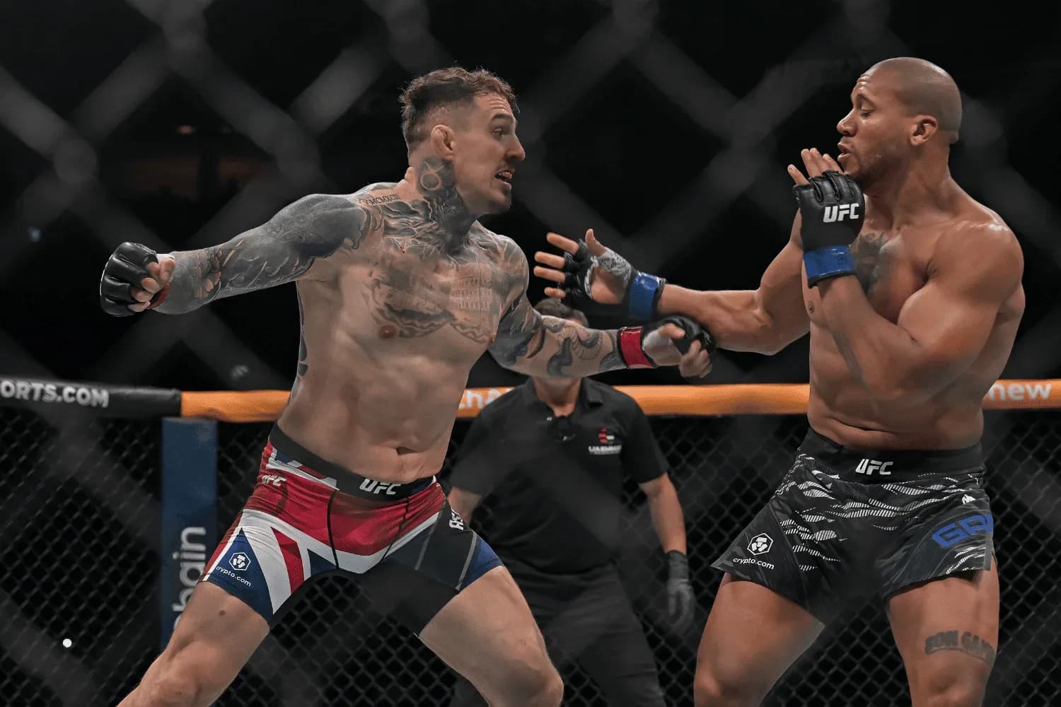 Tom Aspinall (red) of UK competes against French fighter Ciryl Gane (blue) in the Men’s heavyweight category during the UFC 321 Mixed Martial Arts event