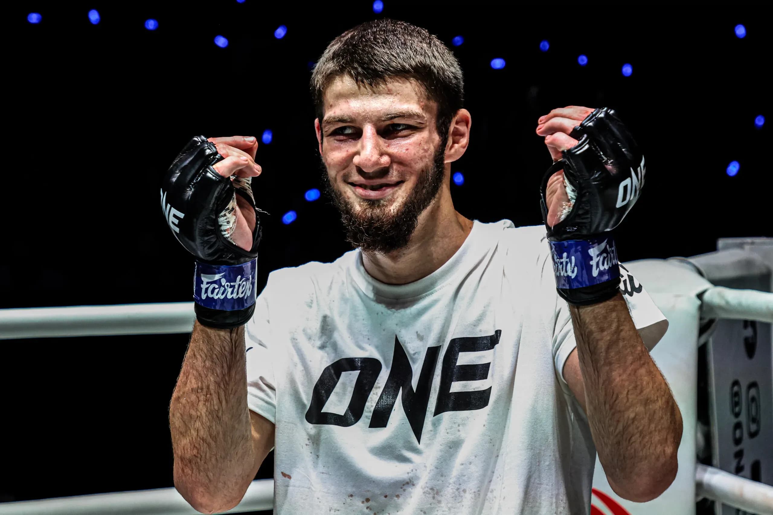 Russian Muay Thai fighter Asadula Imangazaliev smiles following his win