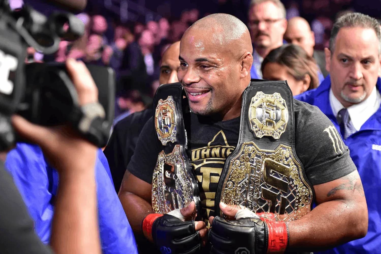 Daniel Cormier with both his belts