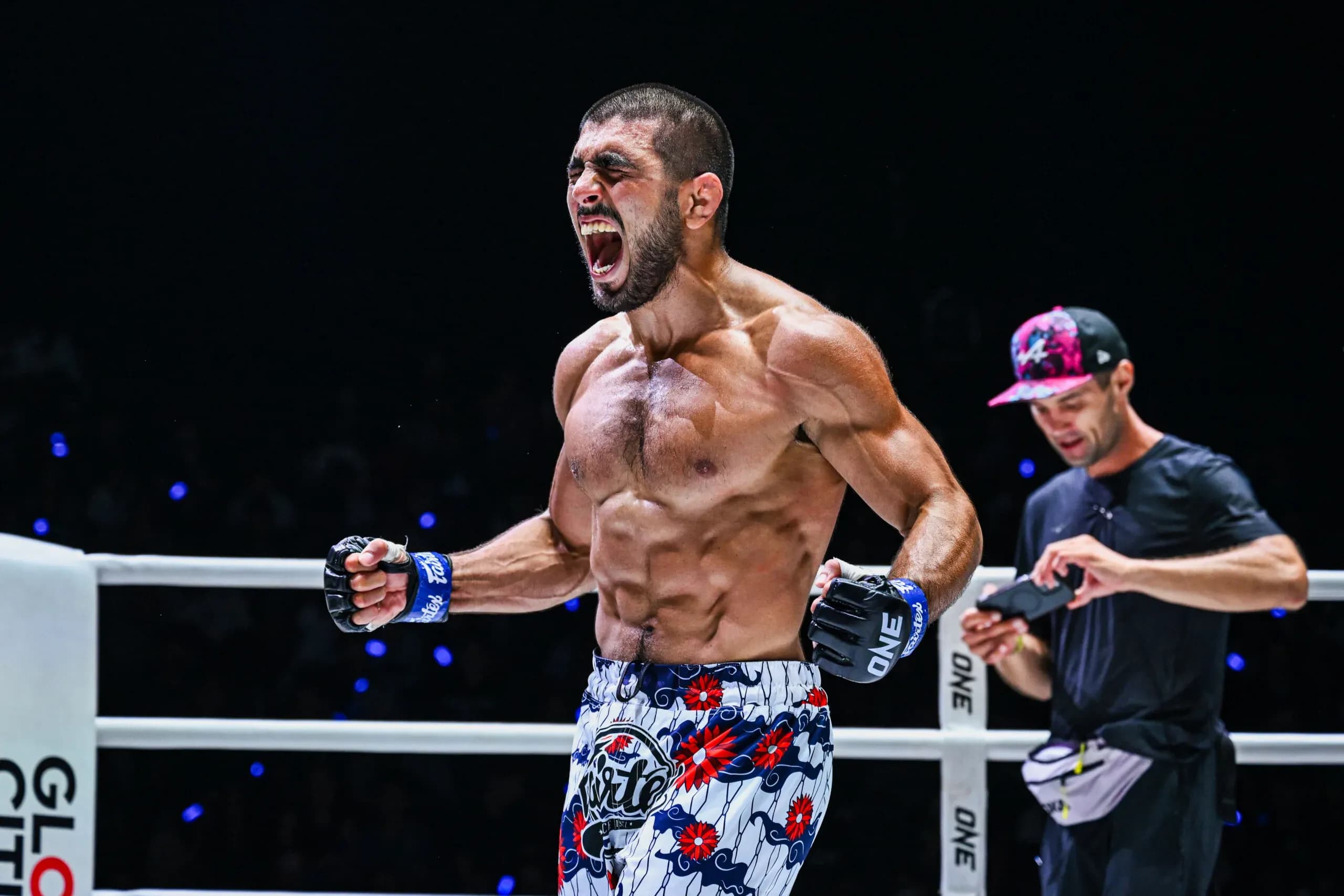 Undefeated MMA fighter Elbek Alyshov celebrates his victory