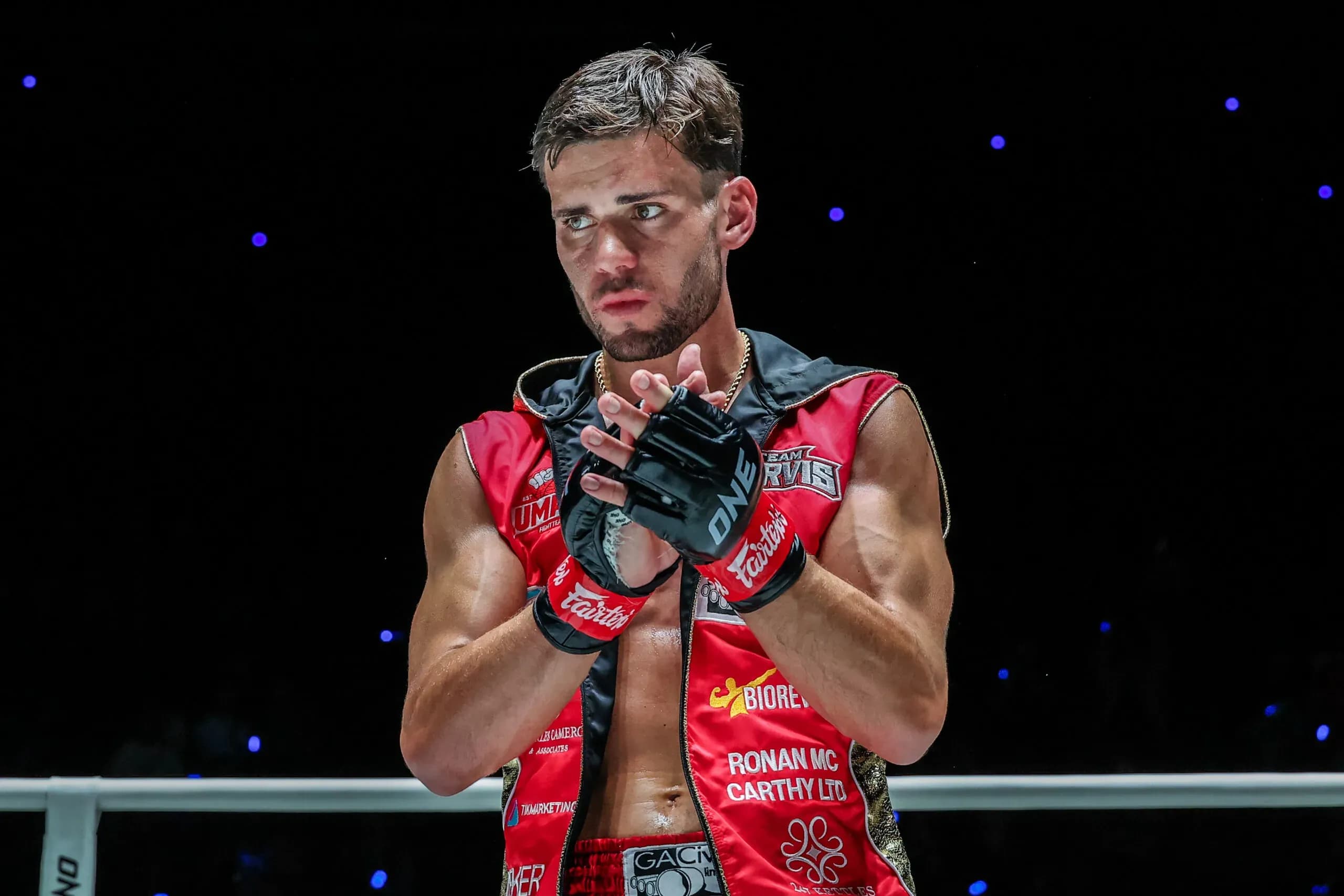 British Muay Thai fighter George Jarvis claps his hands following his win