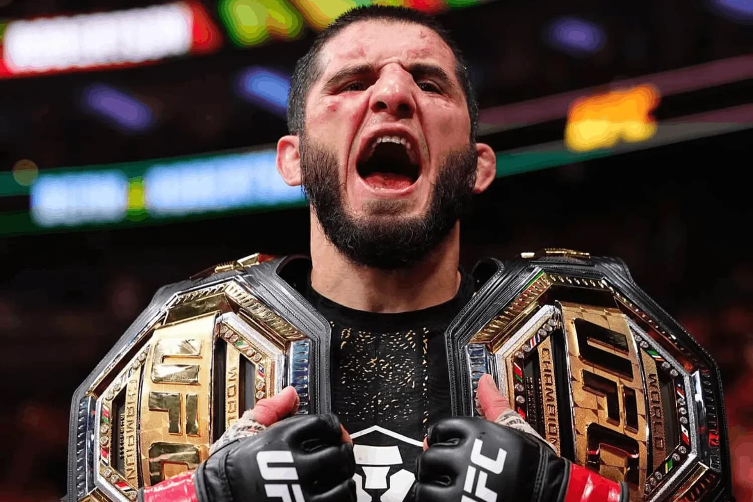 Islam Makhachev with his belts