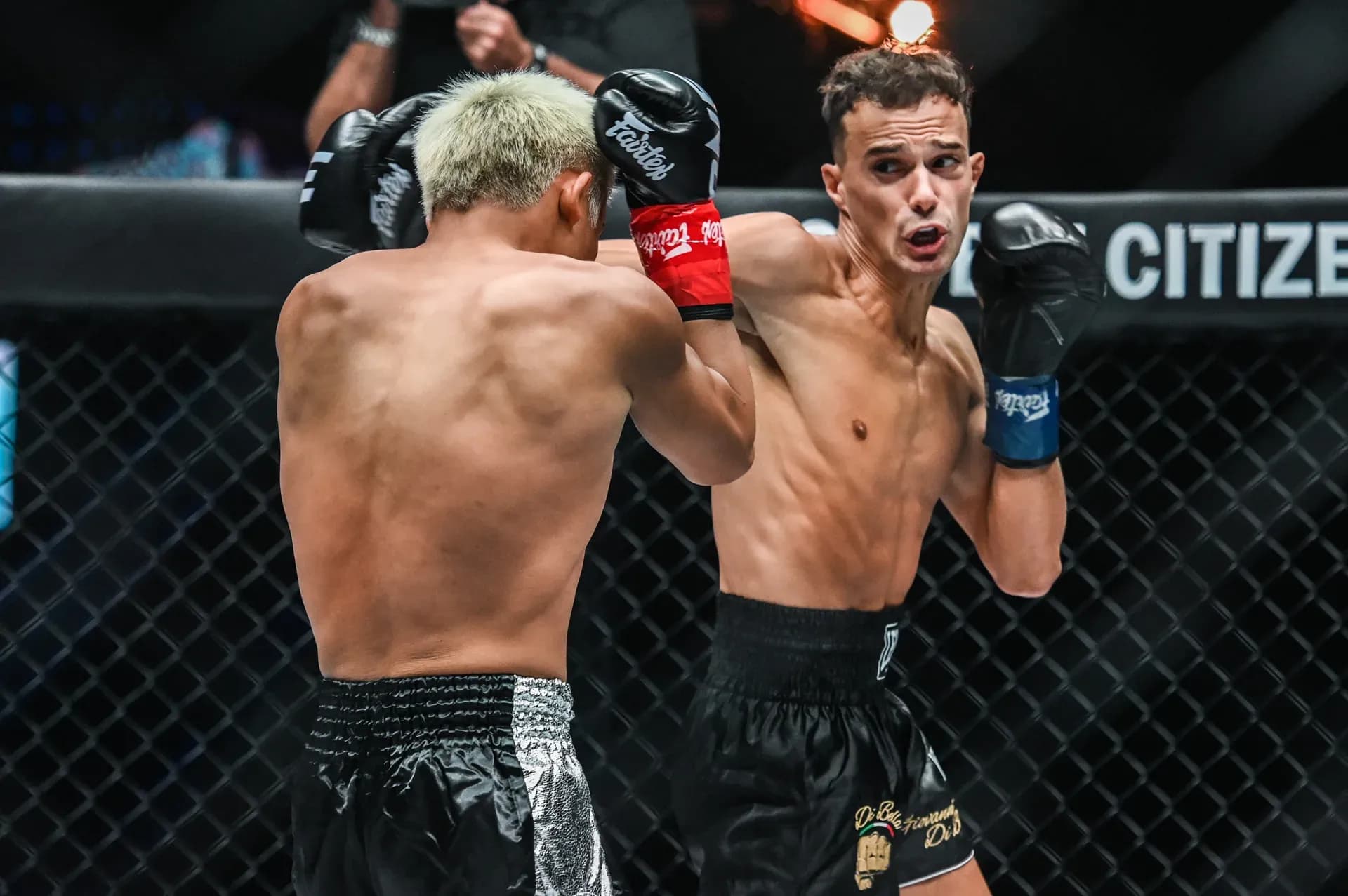 Jonathan Di Bella punches Zhang Peimian