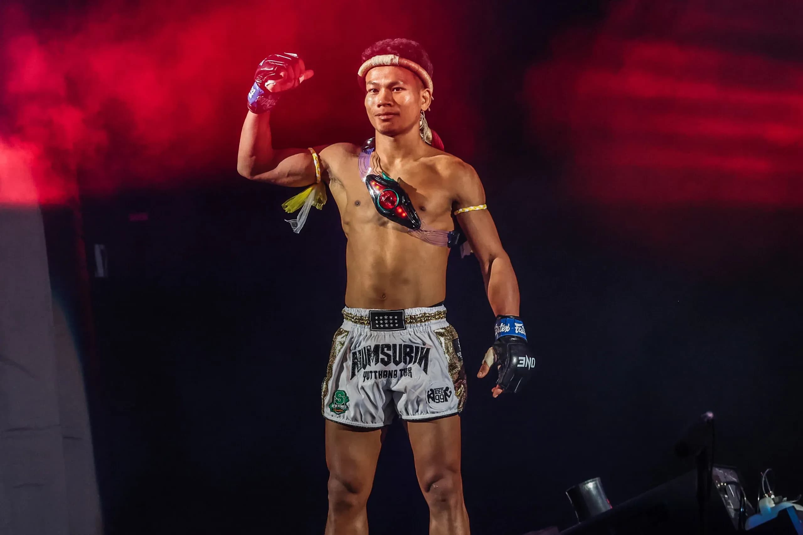 Muay Thai fighter Numsurin Chor Ketwina enters the arena
