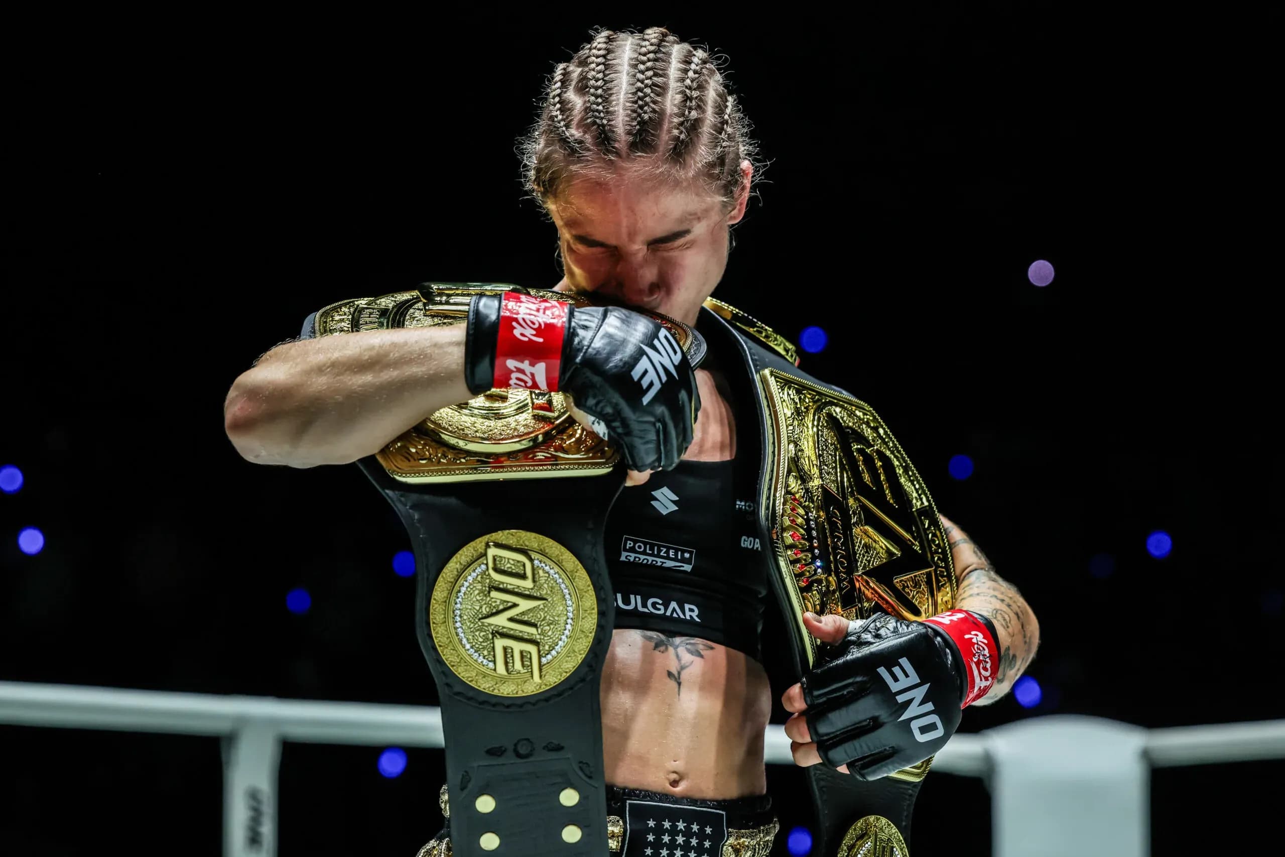 Stella Hemetsberger kisses the ONE Championship belt