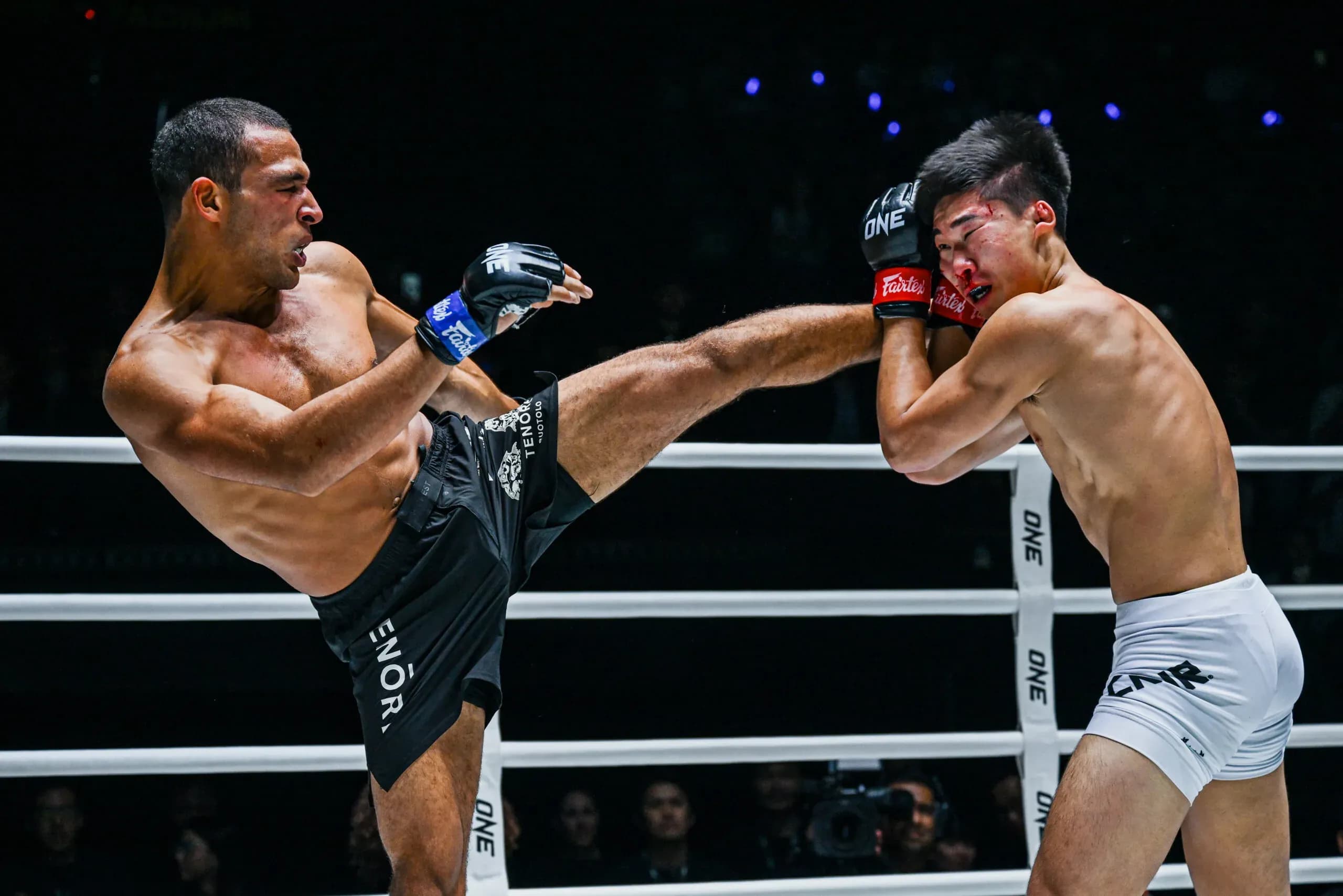 Tye Ruotolo throws a head kick at Adrian Lee in his first MMA fight
