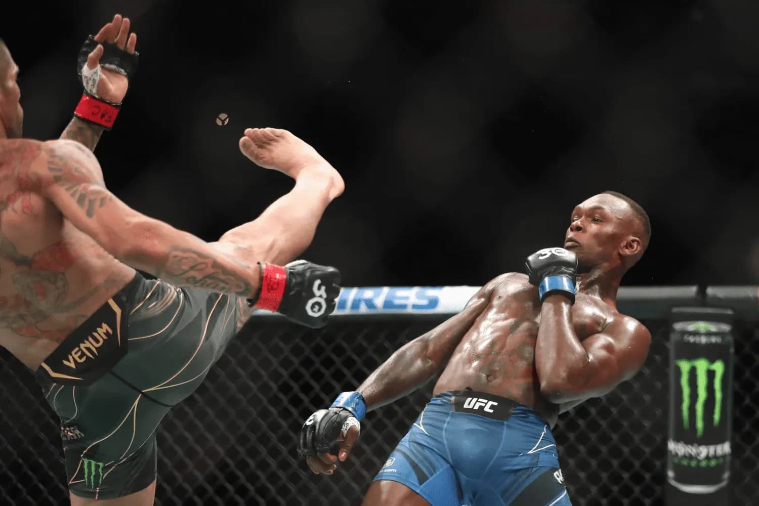 Alex Pereira kicks Israel Adesanya in their middleweight fight during the UFC 287 event at Kaseya Center