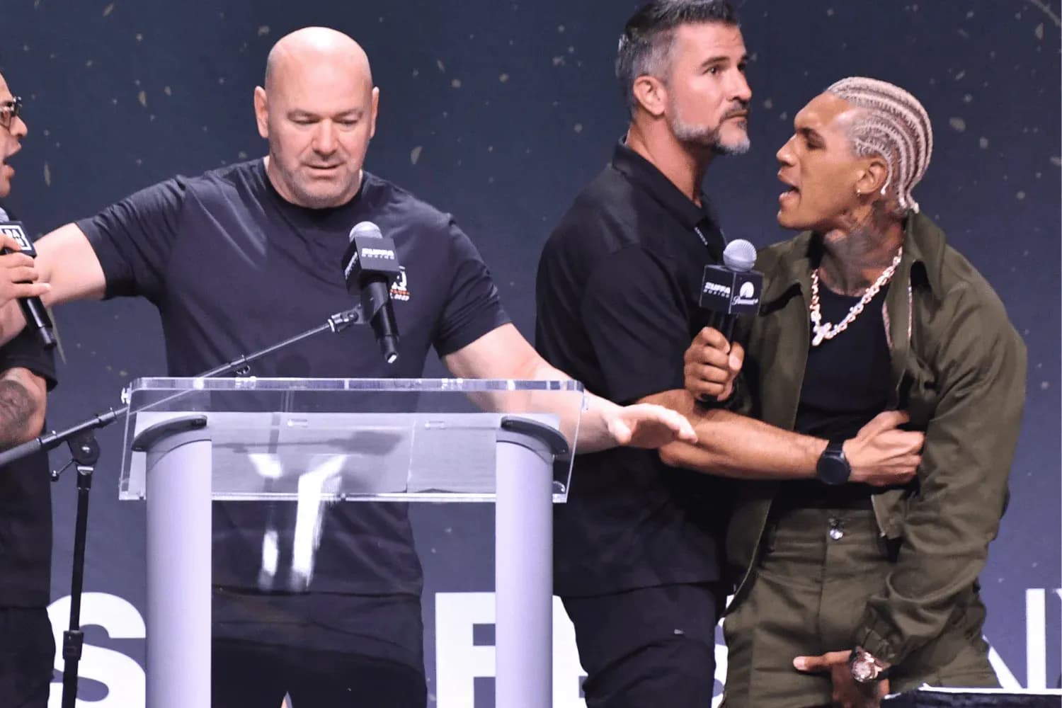 Dana White (left) holda back Conor Benn (right)
