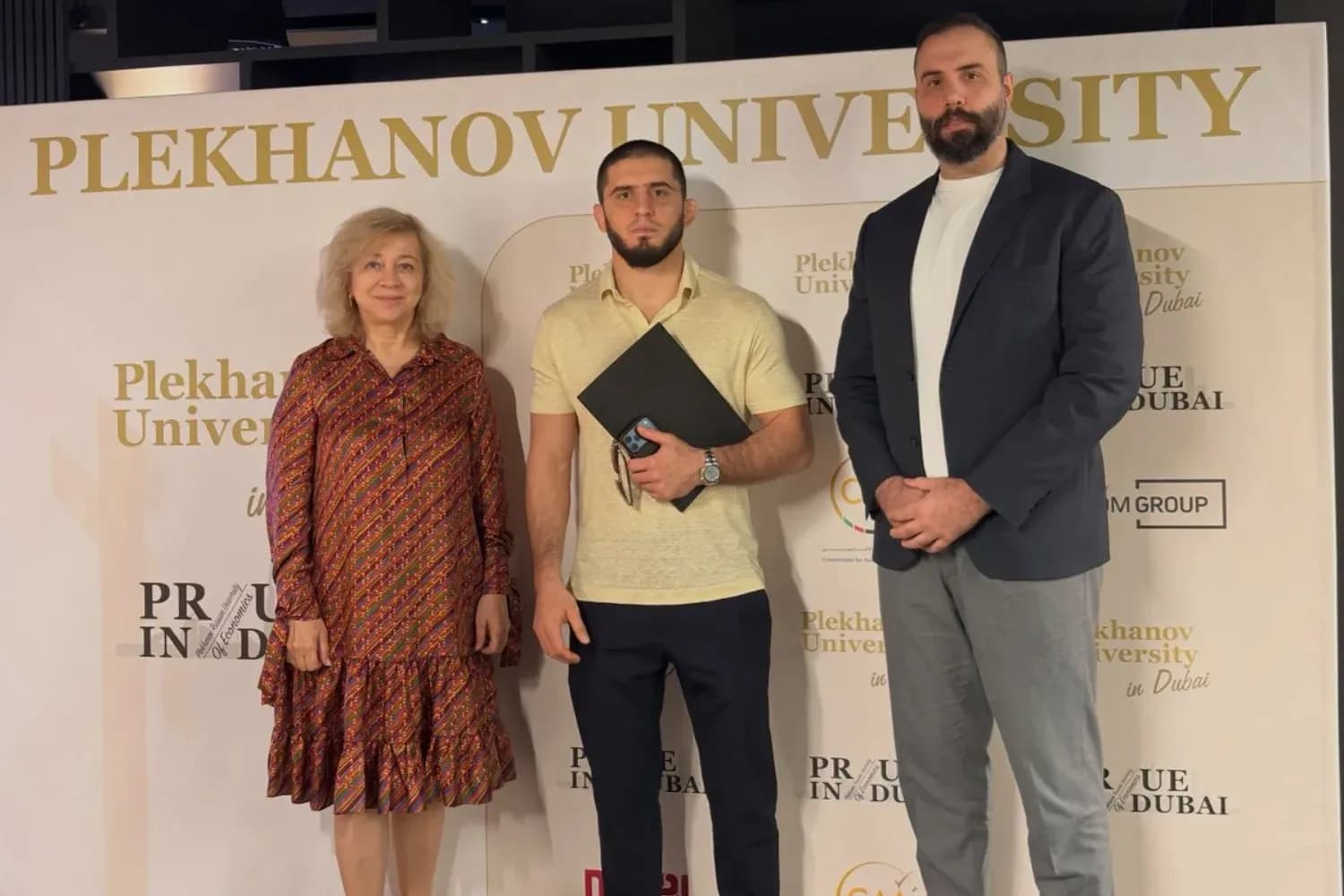 Islam Makhachev poses with faculty at Plekhanov University