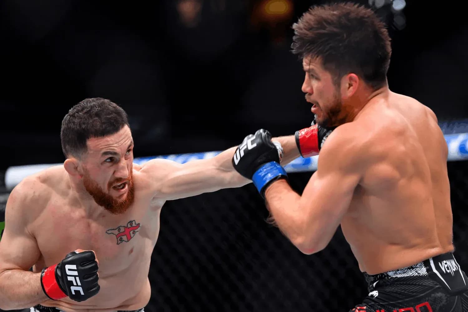 Merab Dvalishvili (left) in the octagon with Henry Cejudo(right)