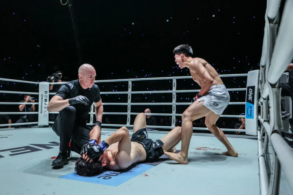 MMA star Adrian Lee celebrates his win over a tired Shozo Isojima