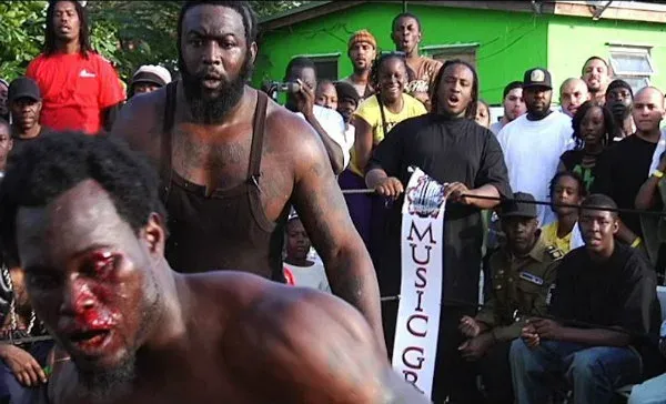 Dada 5000 refereeing a bare-knuckled backyard bout during the filming of Dawg Fight. | Photo: Rakontur