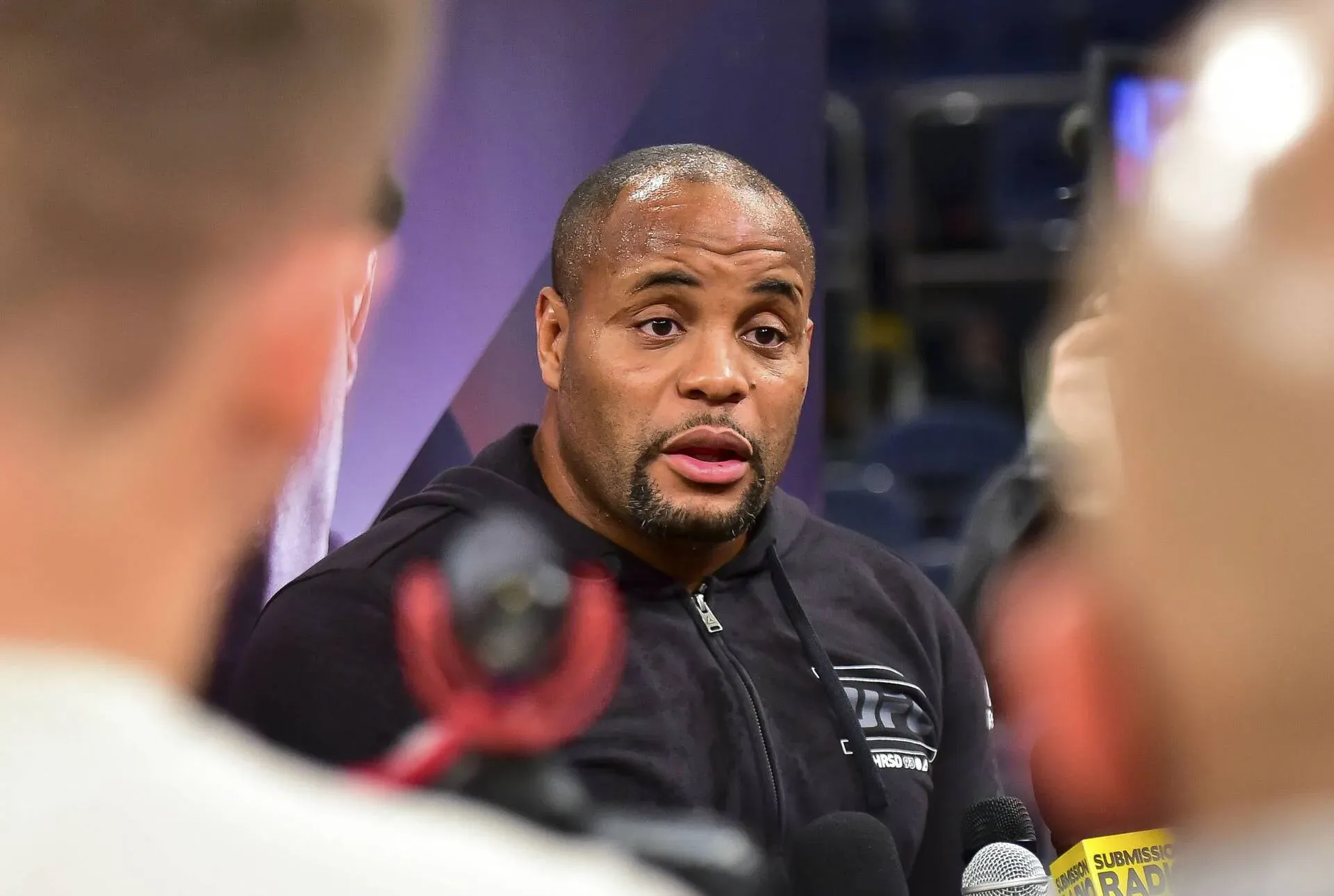 ‘Such a C**k’ – Daniel Cormier Under Fire for Defending Usman Nurmagomedov’s UFC Shanghai Cage Jump