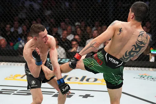 Moreno lands a slick body kick