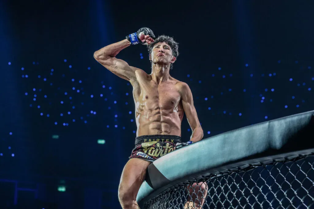 6-foot-4 Muay Thai prodigy Nabil Anane celebrates his victory on the cage