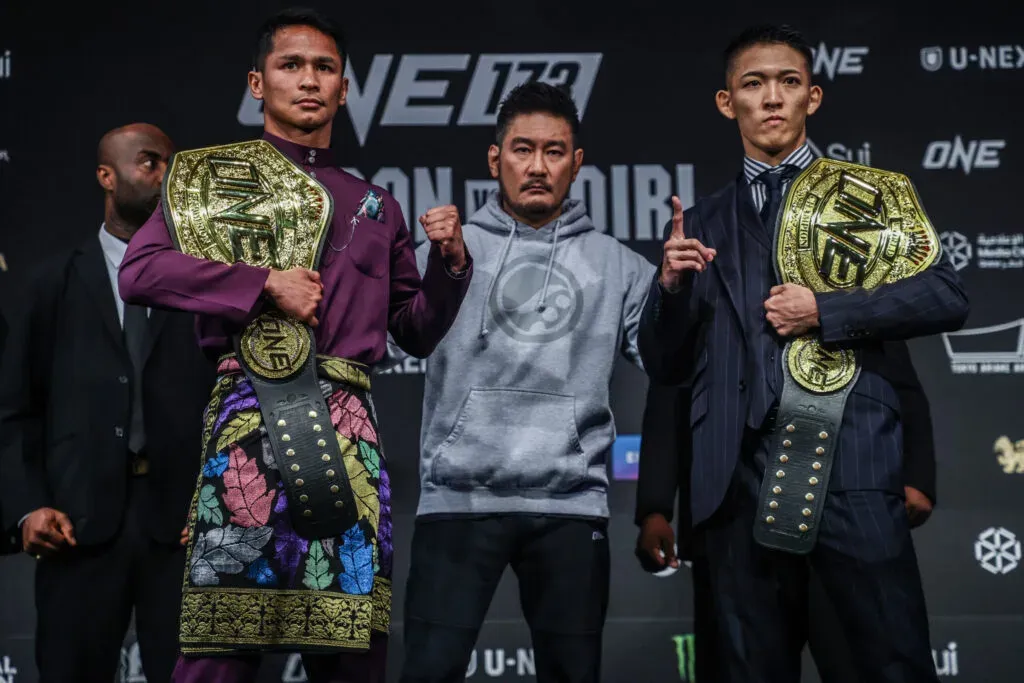 Superbon and Masaaki Noiri pose with their ONE Championship belts at the ONE 173 Press Conference