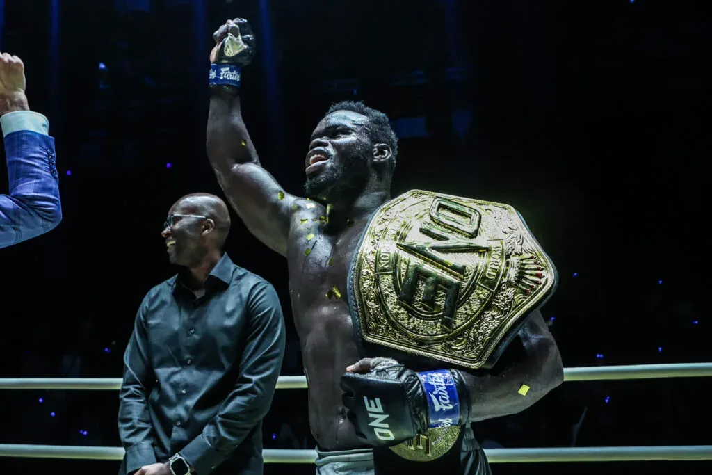 "Reug Reug" Oumar Kane poses with the ONE Championship belt in the ring
