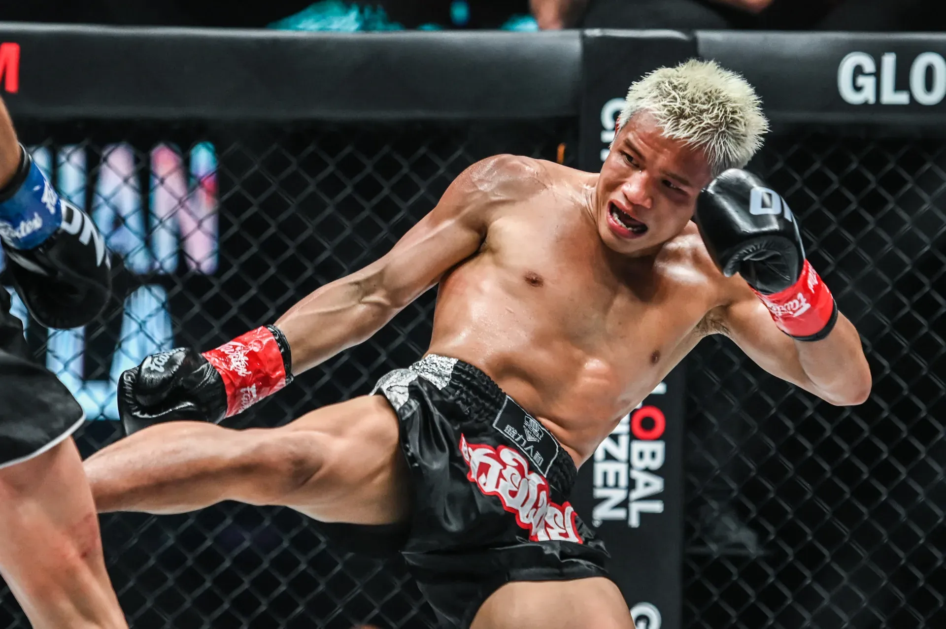Chinese kickboxer Zhang Peimian throws a kick