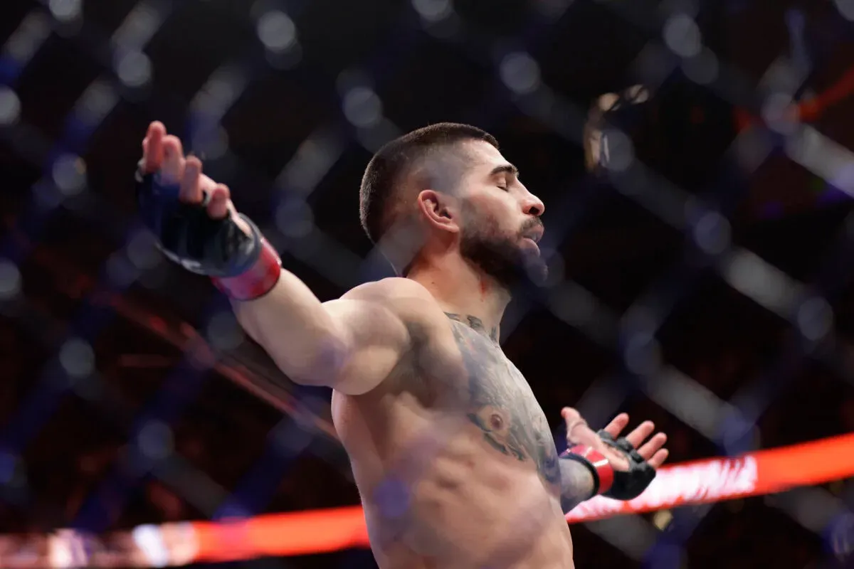UFC White House's Ilia Topuria arms out