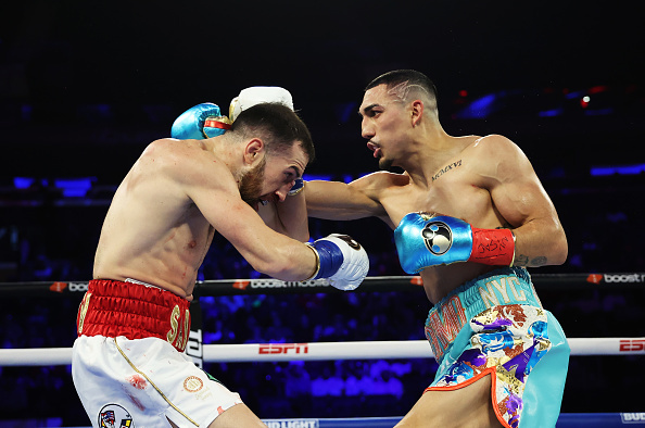 Teofimo Lopez and Sandor Martin exchange.